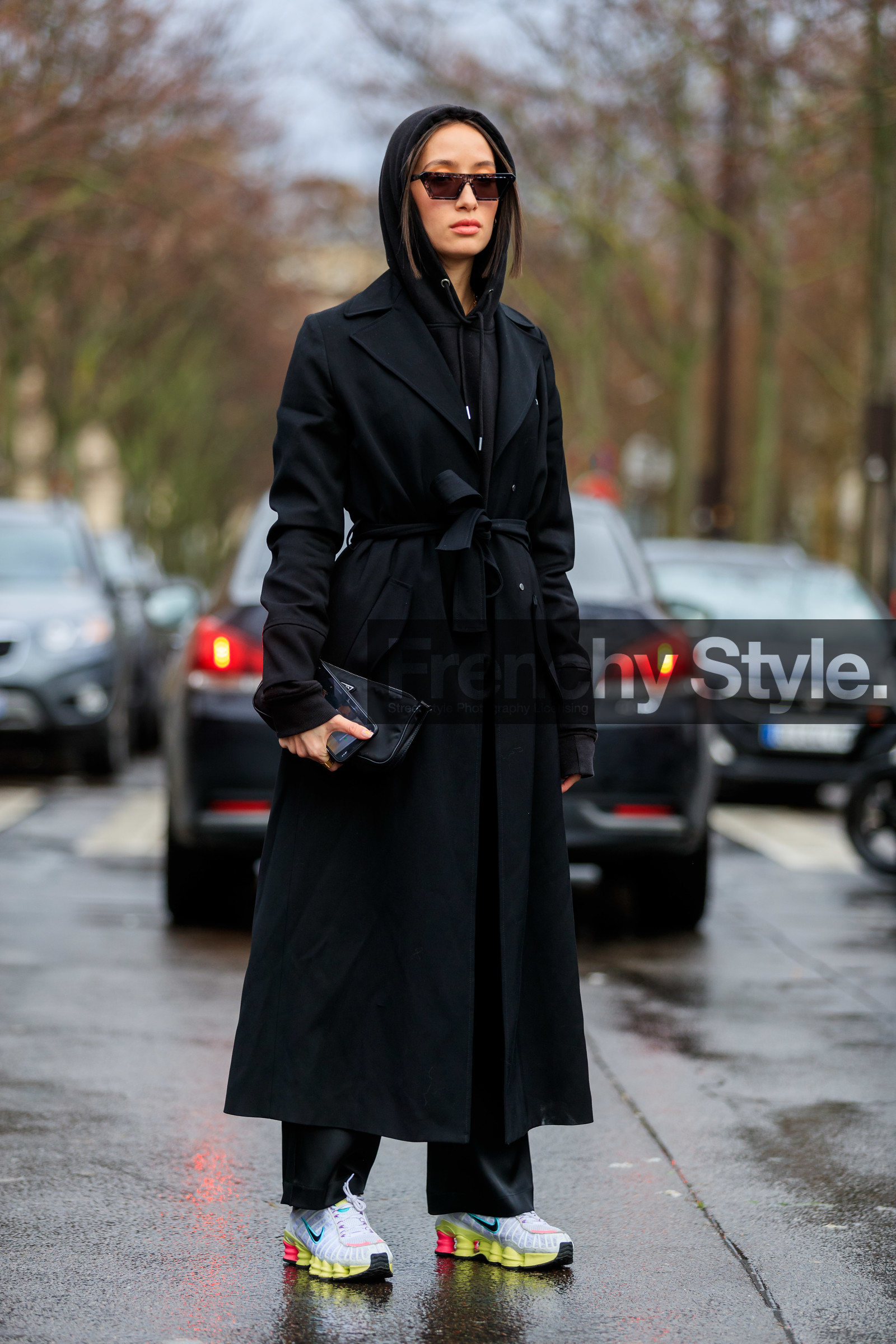 alexandra guerain, black hoodie, black trench coat, black pants, belted trench coat, off white trench coat, nike shoes, white sneakers, yellow sneakers, futurist shape sunglasses, scale sunglasses, purple sunglasses, fashion week, frenchystyle, FW, jonathan paciullo, street style, PFW, PARIS, vertical, full length