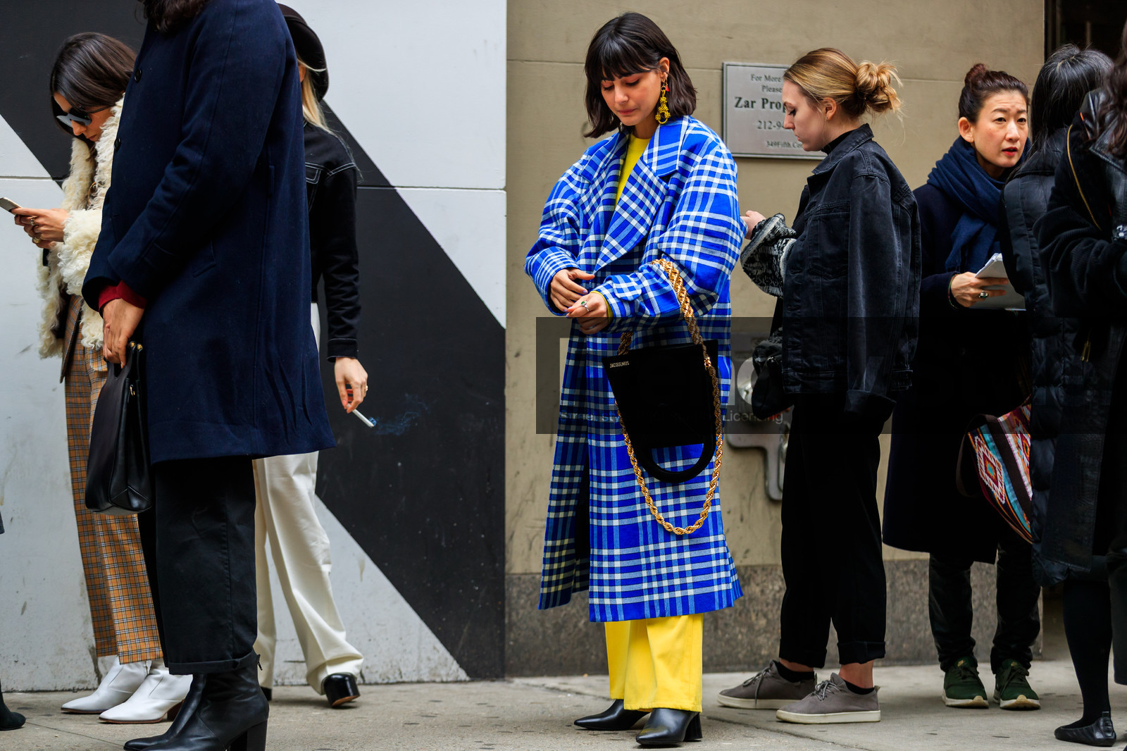 black bag, black shoes, blue coat, checked, checked coat, earrings, graphic jacket, high heels, jacquemus, leather bag, leather shoes, plaid, printed jacket, trousers, yellow pants, yellow sweater, street style, jonathan paciullo, FW, frenchystyle, fashion week, NYFW, NEW YORK, AUTUMN WINTER 2018-2019, AW 18-19, FALL WINTER 2018-2019, FW 18-19, atmosphere details, horizontal, full length, maria bernad