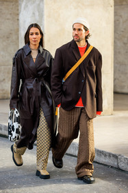 leather trench, brown trench, gucci pants, logo pants, beige bottines, cow print bag, animal print bag, coperni bag, beige top, cut out top, oatmeal beanie, orange sweatshirt, brown blazer, crossbody bag, baggy pants, brown trousers, dark brown mocassins, couple, fashion week, frenchystyle, FW, jonathan paciullo, street style, PFW, PARIS, menswear, FALL WINTER 2022-2023, AUTUMN WINTER 2022-2023, FW 22-23, full length, vertical