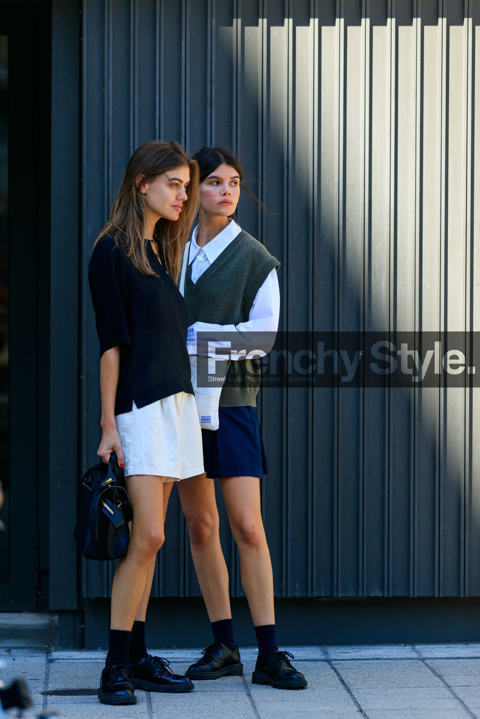 school girl look, black polo shirt, oversize polo shirt, light beige shorts, loose shorts, black leather bag, hand bag, doc marteens shoes, black leather shoes, black socks, laced shoes, high waist shorts, white shirt, oversize shirt, knitwear, sleeveless pullover, kaki pullover, man style pullover, porter bag, crossbody bag, black and white bag, square shape bag, navy blue skirt, pleated skirt, long sleeves shirt, oversize sleeves, fashion week, frenchystyle, FW, jonathan paciullo, street style, vertical, full length