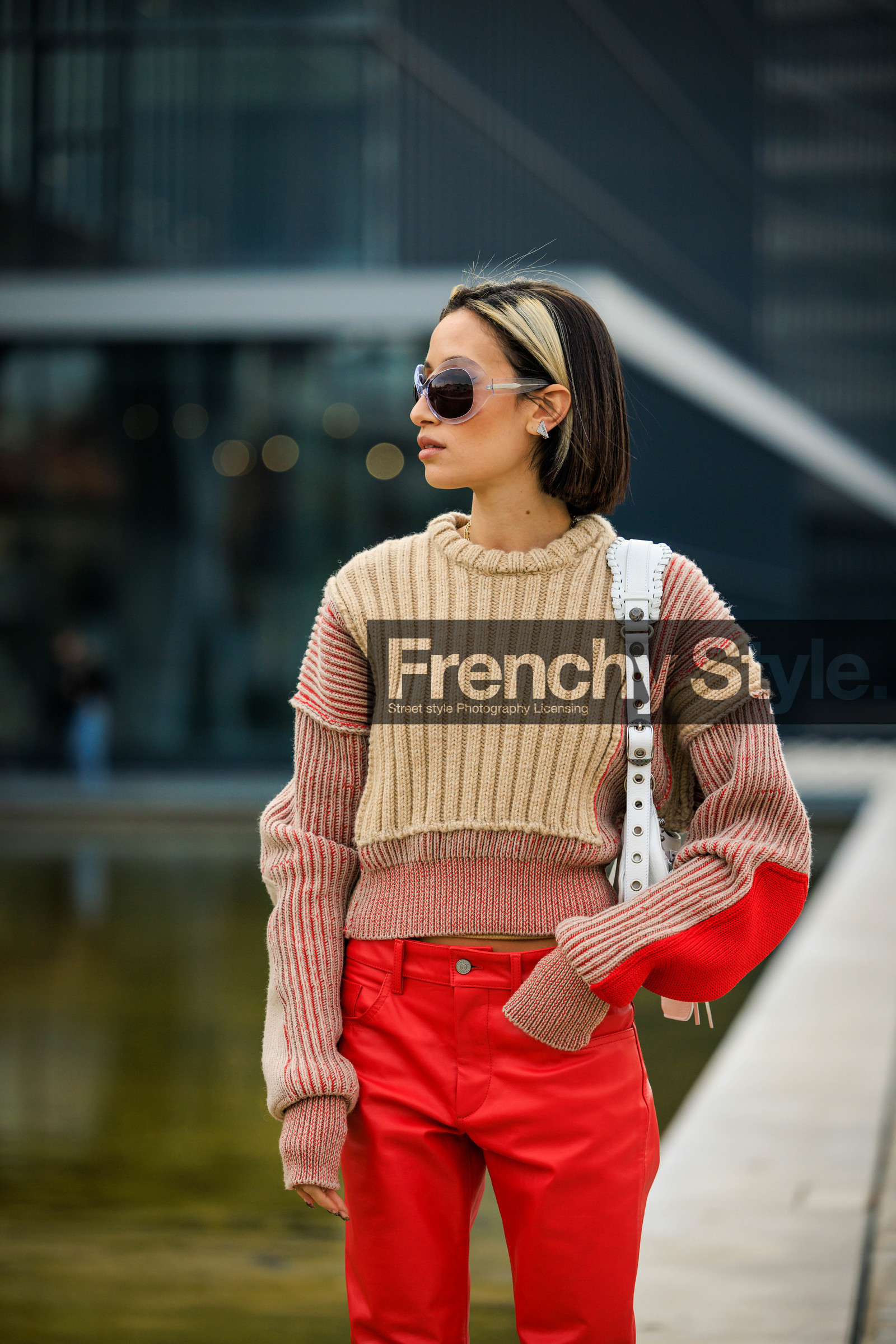 red pants, knitted jumper, pleated jumper, dual toned jumper, beige jumper, balenciaga bag, white handbag, leather handbag, short hair, dyed hair, silver studs, details, ufo glasses, black sunglasses, alexandra guerain, street style, jonathan paciullo, FW, frenchystyle, fashion week, MFW, MILAN, FALL WINTER 2022_2023, AUTUMN WINTER 2022-2023, FW 22-23, vertical, atmosphere details