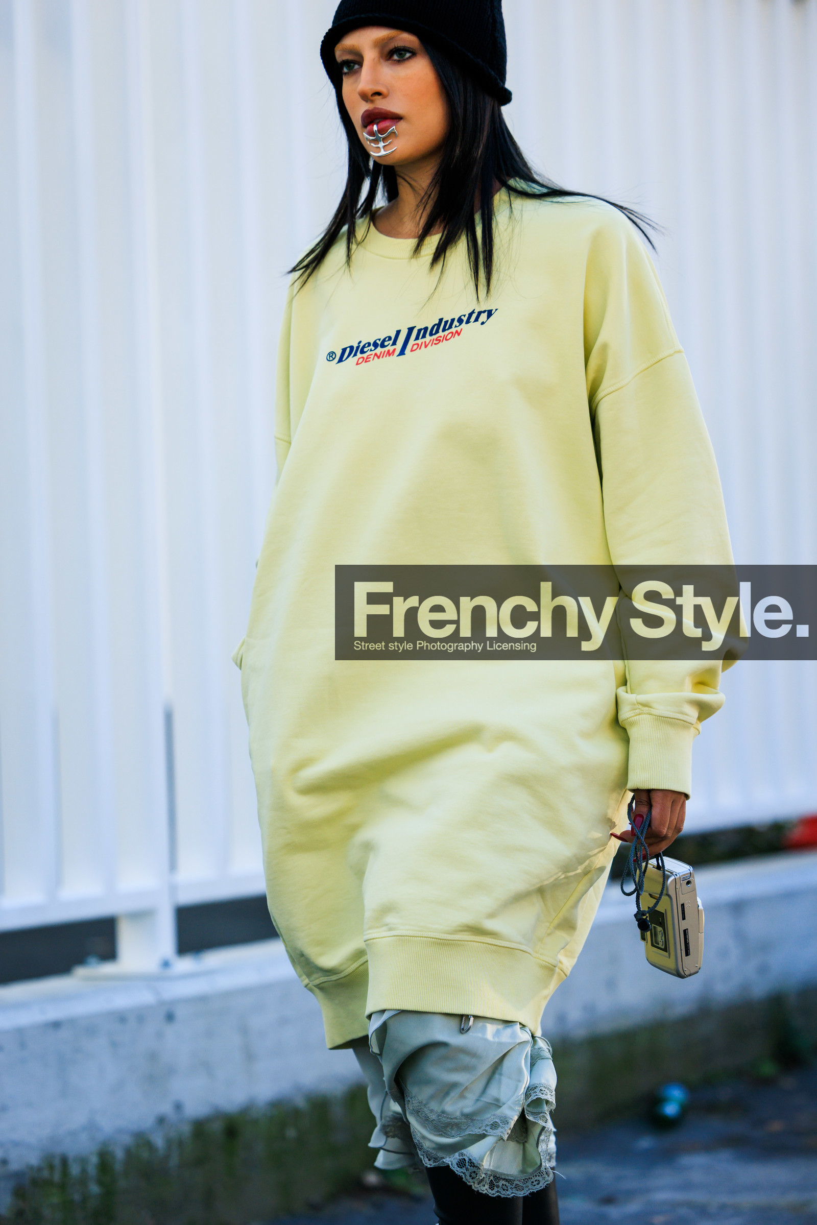 diesel sweatshirt, yellow sweatshirt, black beanie, mouth accesorie, laced dress, silver camera, fashion week, frenchystyle, FW, jonathan paciullo, street style, MFW, MILAN, FALL WINTER 2022_2023, AUTUMN WINTER 2022-2023, FW 22-23, vertical, atmosphere details