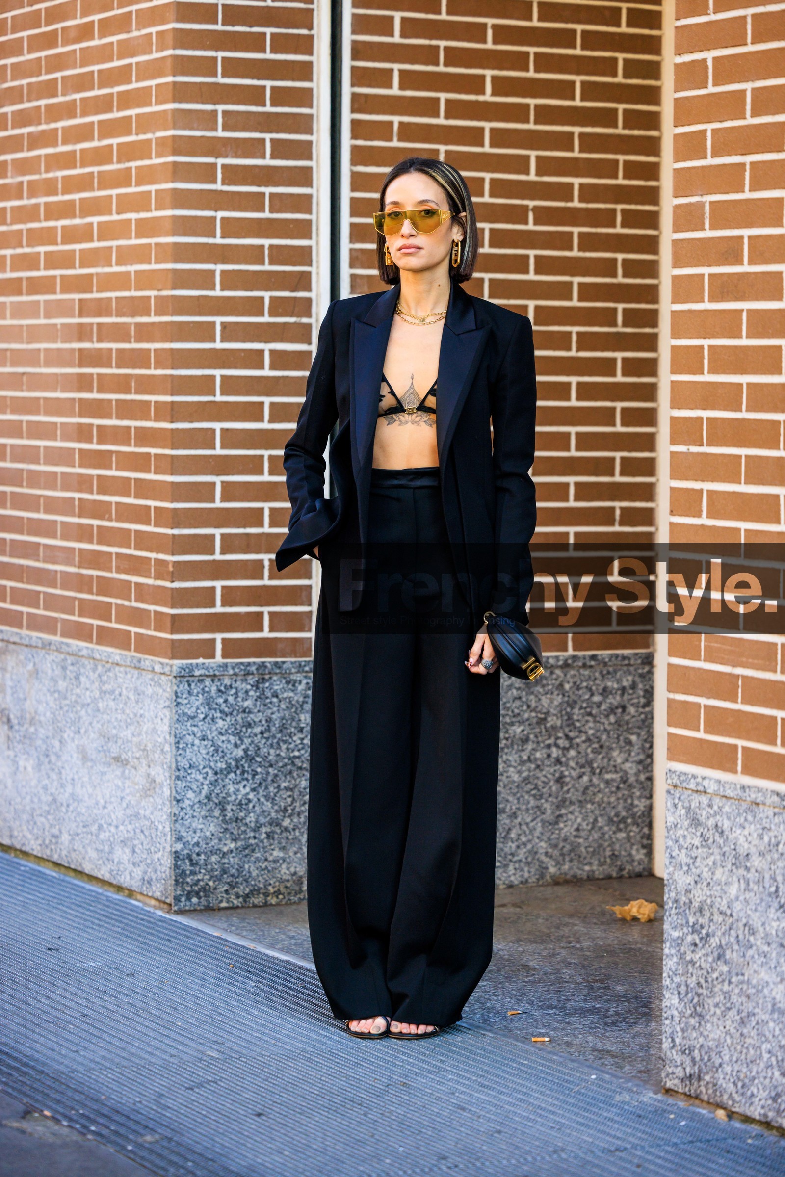 fendi bra, black suit, black blazer, baggt pants, higwaist trousers, fendi mini bag, fendi look, yellow sunglasses, overlayed necklaces, fendi earrings, minimal look, mini black bag, black sandals, alexandra guerain, fashion week, frenchystyle, FW, jonathan paciullo, street style, MFW, MILAN, FALL WINTER 2022_2023, AUTUMN WINTER 2022-2023, FW 22-23, vertical, full length