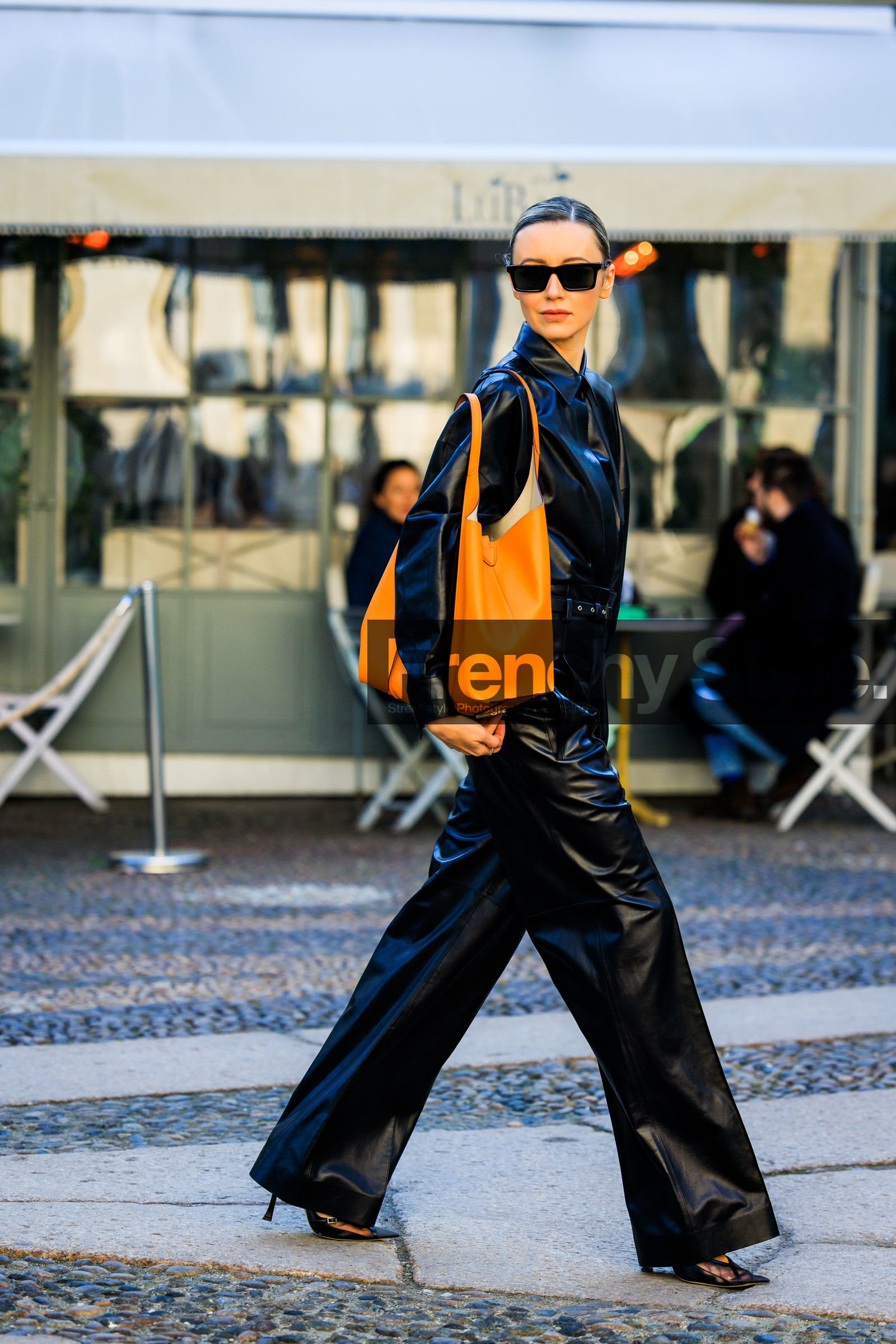 orange tote bag, leather tote bag, full black look, black leather pants, leather jacket, black sandals, heeled sandals, black sunglasses, nataly osmann, street style, jonathan paciullo, FW, frenchystyle, fashion week, MFW, MILAN, FALL WINTER 2022_2023, AUTUMN WINTER 2022-2023, FW 22-23, vertical, full length