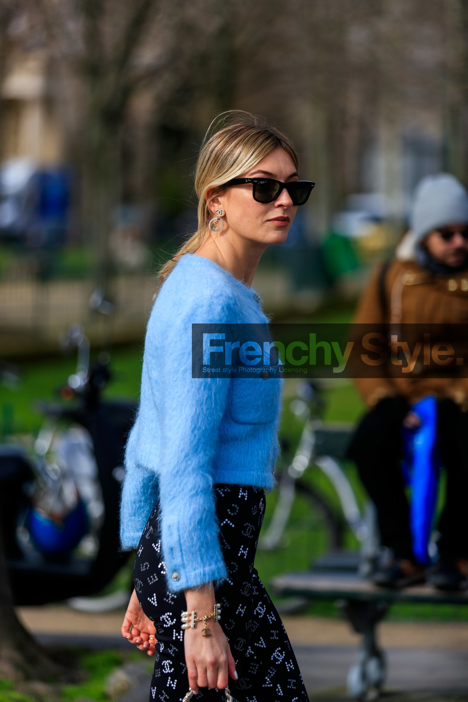 camille charriere, light blue cardigan, mohair cardigan, button cardigan, strassed cardigan, strassed pants, black pants, tight pants, rayban sunglasses, strassed earrings, round shape earrings, logo earrings, close up detail, chanel cardigan, chanel pants, chanel earrings, fashion week, frenchystyle, FW, jonathan paciullo, street style, PFW, PARIS, vertical, atmosphere details, detail