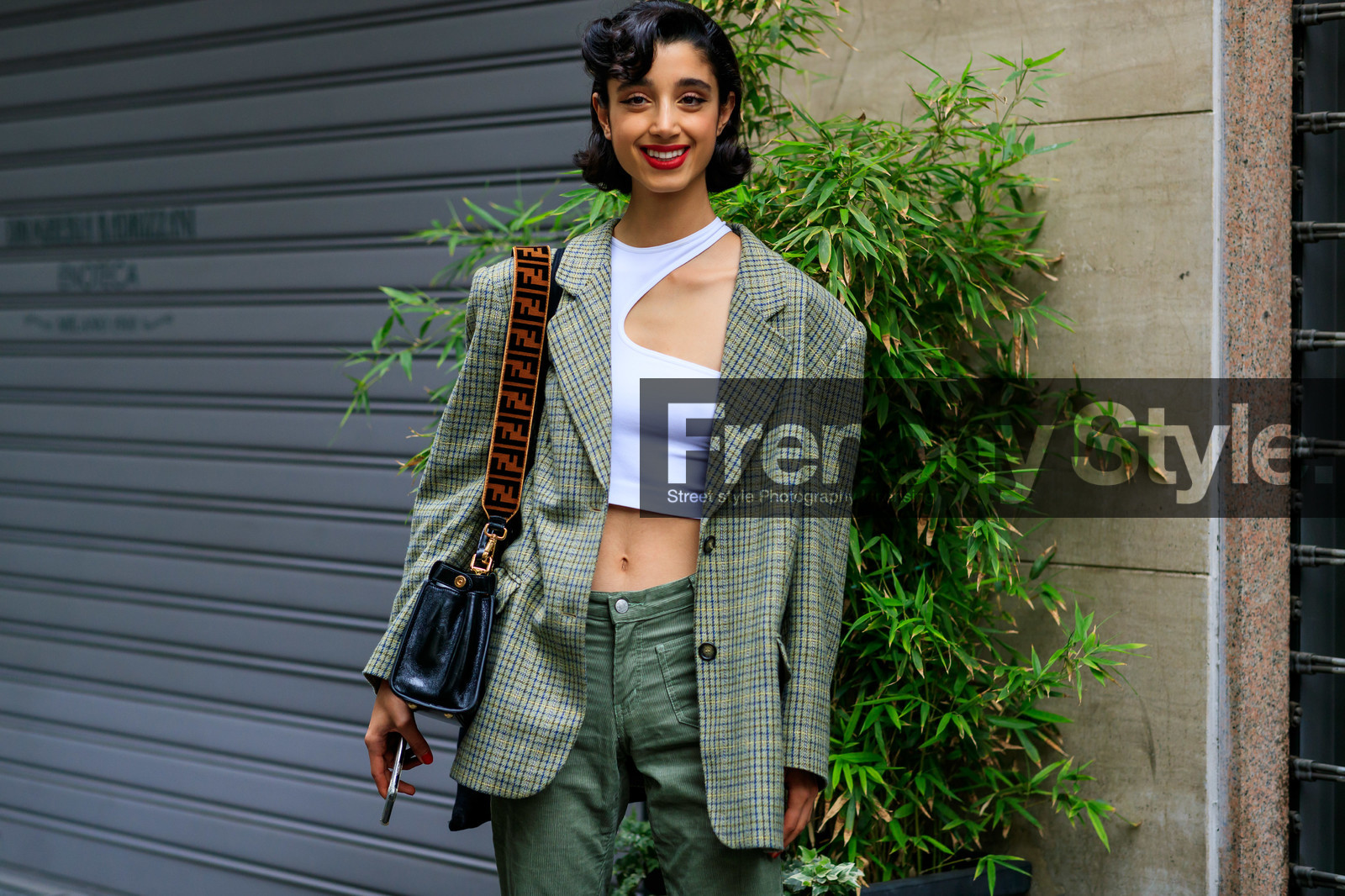 model, black eyeliner, make up, make up details, red lipstick, white top, asymmetrical top, openwork top, cropped top, checked jacket, fendi strap bag, monogrammed strap bag, velvet strap bag, black leather bag, shoulder bag, fendi bag, beige jacket, oversize jacket, kaki pants, corduroy pants, fashion week, frenchystyle, FW, jonathan paciullo, street style, atmosphere details, detail, horizontal, MFW, MILAN, SPRING SUMMER 2020, SS 20