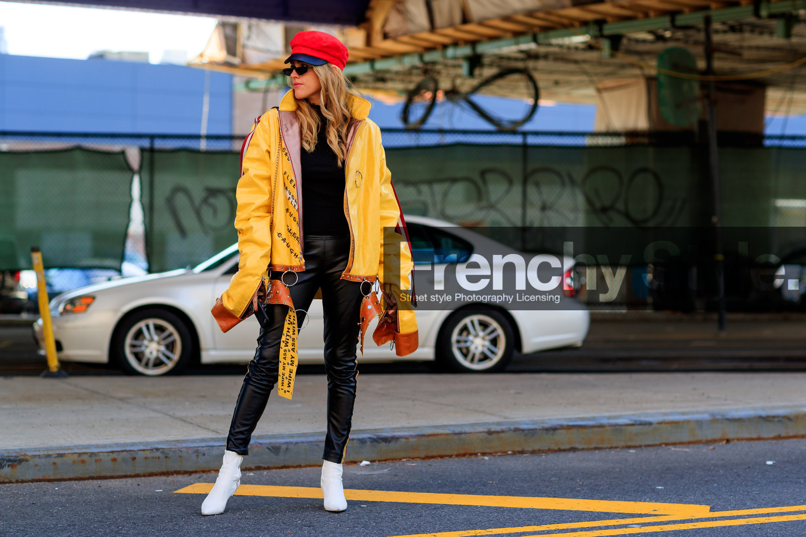 black pants, black sweater, graphic jacket, high heels, leather jacket, leather pants, leather shoes, message, printed jacket, red hat, sunglasses, trousers, white shoes, yellow jacket, street style, jonathan paciullo, FW, frenchystyle, fashion week, NYFW, NEW YORK, AUTUMN WINTER 2018-2019, AW 18-19, FALL WINTER 2018-2019, FW 18-19, atmosphere details, horizontal, full length