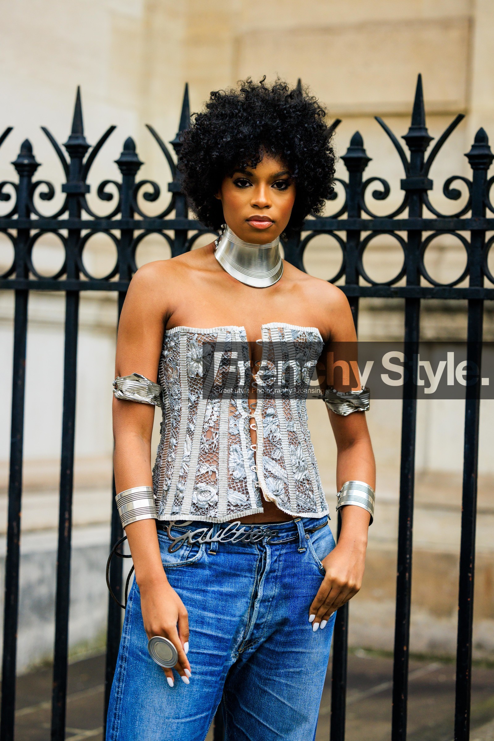 chunky choker, silver choker, jean paul gaultier belt, silver belt, afro hair, arm cuffs, silver cuffs, silver bracelets, disk ring, classic jeans, silver corset, embroidered corset, smoky eyes, white nails, corset top, fashion week, frenchystyle, FW, jonathan paciullo, street style, PARIS, PFW, SPRING SUMMER 2022, SS 22, atmosphere details, detail, vertical, didi stone