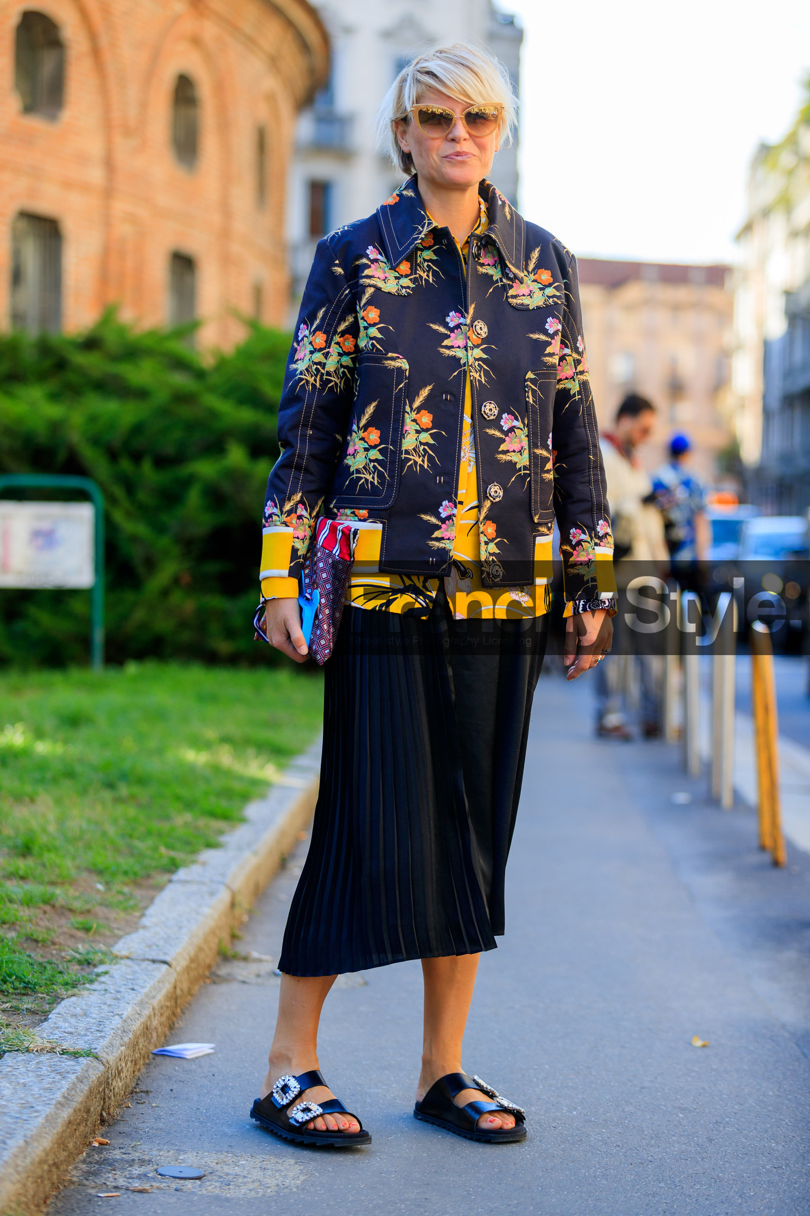 black jacket, black sandals, black shoes, black skirt, elisa nalin, fashion week, floral, flowers, frenchystyle, full length, FW, graphic jacket, graphic shirt, jonathan paciullo, leather bag, leather shoes, MFW, MILAN, pleated skirt, printed jacket, printed shirt, SPRING SUMMER 2018, SS 18, street style, sunglasses, vertical, yellow shirt