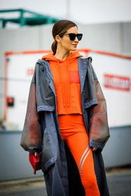 orange hoodie, rain coat, grey jacket, loewe coat, black sunglasses, orange leggings, red handbag, loewe handbag, gala gonzalez, street style, jonathan paciullo, FW, frenchystyle, fashion week, AUTUMN WINTER 2022-2023, FALL WINTER 2022_2023, FW 22-23, PFW, PARIS, vertical, detail