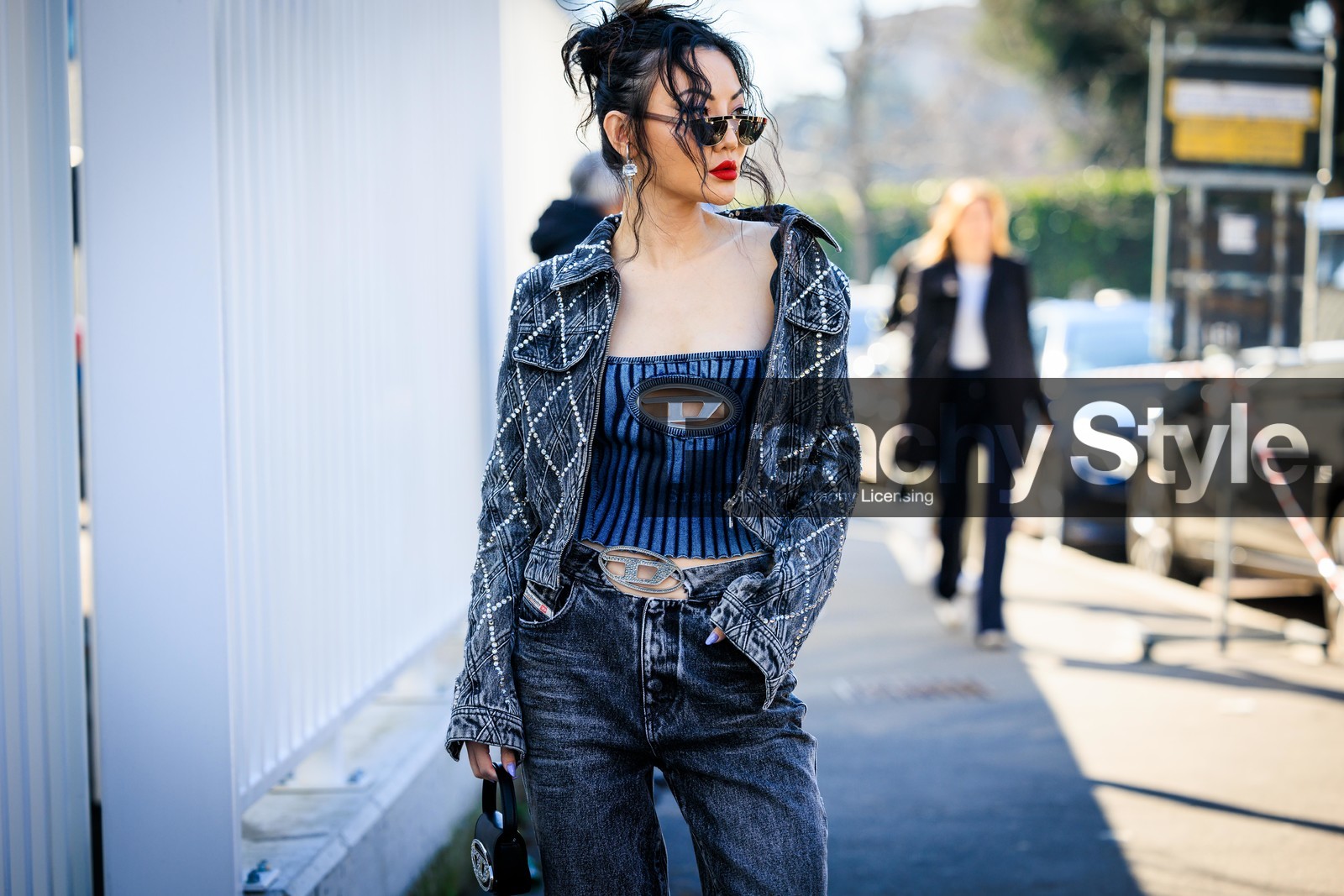 full diesel look, full denim look, black sunglasses, strapless top, denim top, diesel logo top, studded jacket, denim short jacket, dark grey jacket, dark grey jeans, red lips, mini diesel bag, mini black handbag, jessica wang, fashion week, frenchystyle, FW, jonathan paciullo, street style, MFW, MILAN, FALL WINTER 2022_2023, AUTUMN WINTER 2022-2023, FW 22-23, horizontal, atmosphere details