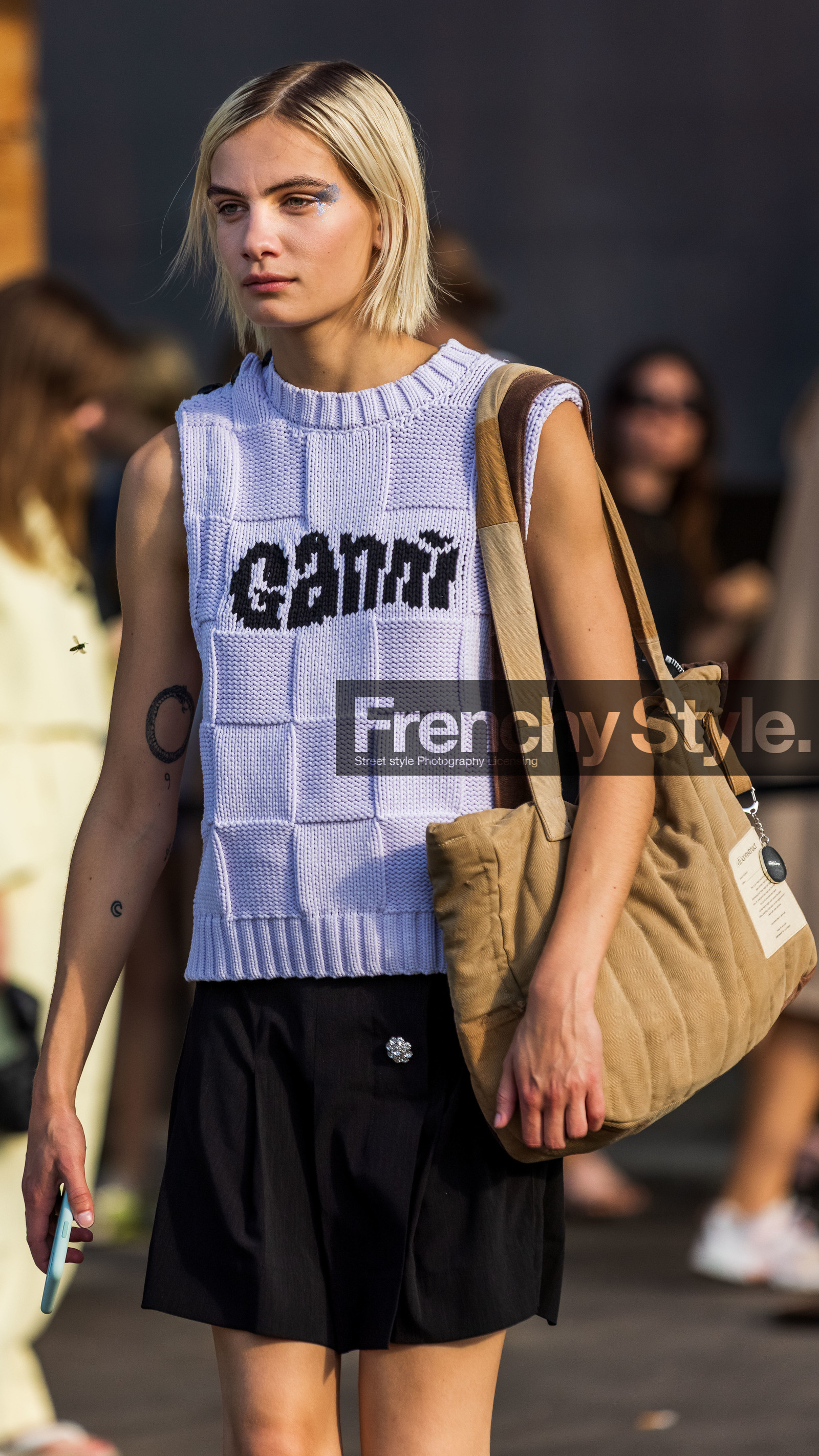 bag, beige bag, black skirt, detail, ganni knit, knit, knitted sock, knitwear, logo print, makeup, mini skirt, pleated skirt, printed knit, shirt skirt, silver eyeshadow, skirt, sleveless knit, sock, tattoo, tote bag, white knit, Nina Marker, fashion week, frenchystyle, FW, jonathan paciullo, street style, CPHFW, COPENHAGEN, SS 22, SPRING SUMMER 2022, vertical, atmosphere details