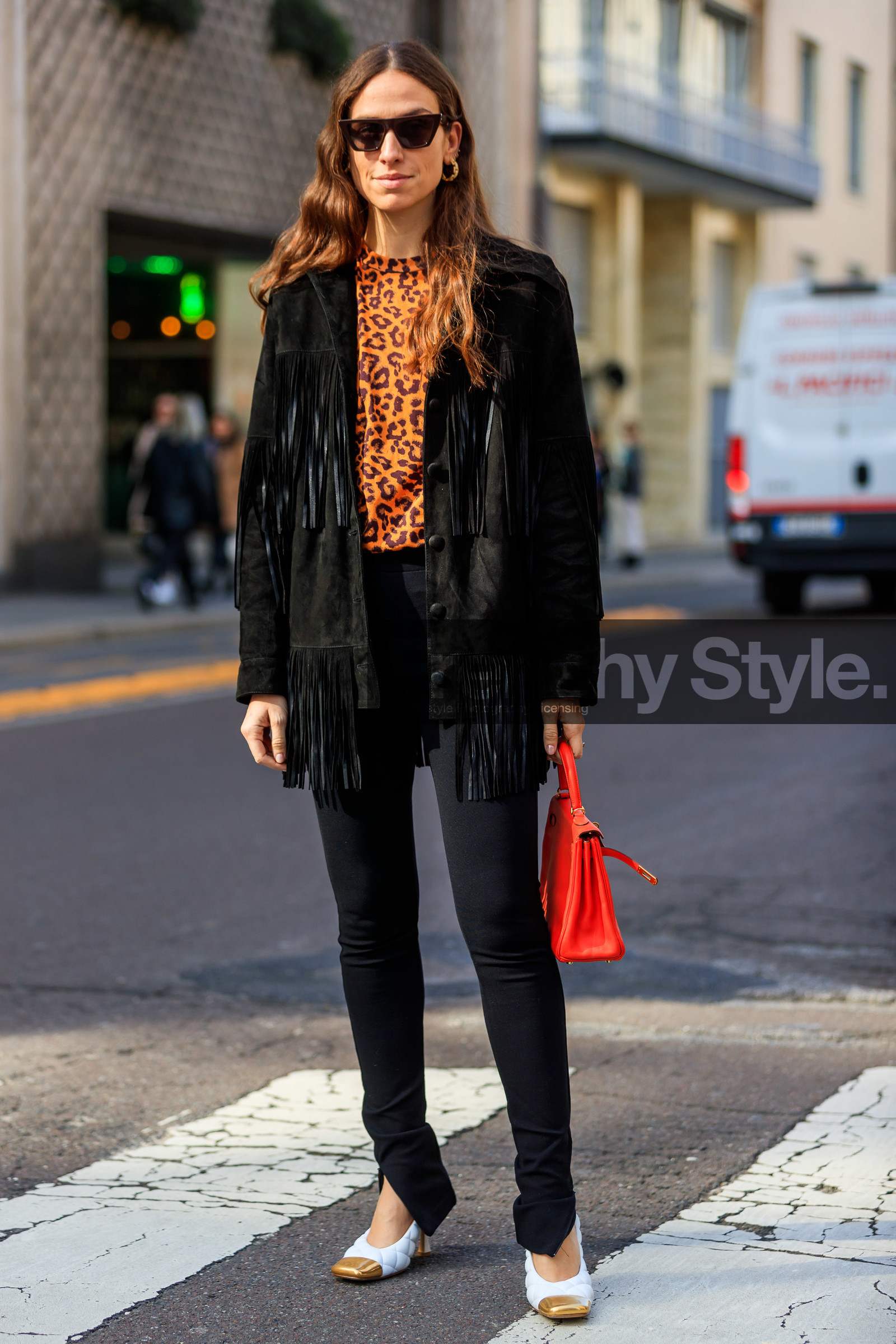 erika boldrin, black suede jacket, fringe jacket, cowboy jacket, black pants, tight pants, split pants, white leather shoes, quilted shoes, golden shoes, red leather bag, hand bag, bottega veneta shoes, orange t-shirt, leopard printed t-shirt, futurist shape sunglasses, butterfly sunglasses, fashion week, frenchystyle, FW, jonathan paciullo, street style, MFW, MILAN, AUTUMN WINTER 2020-2021, FALL WINTER 2020-2021, FW 20-21, vertical, full length