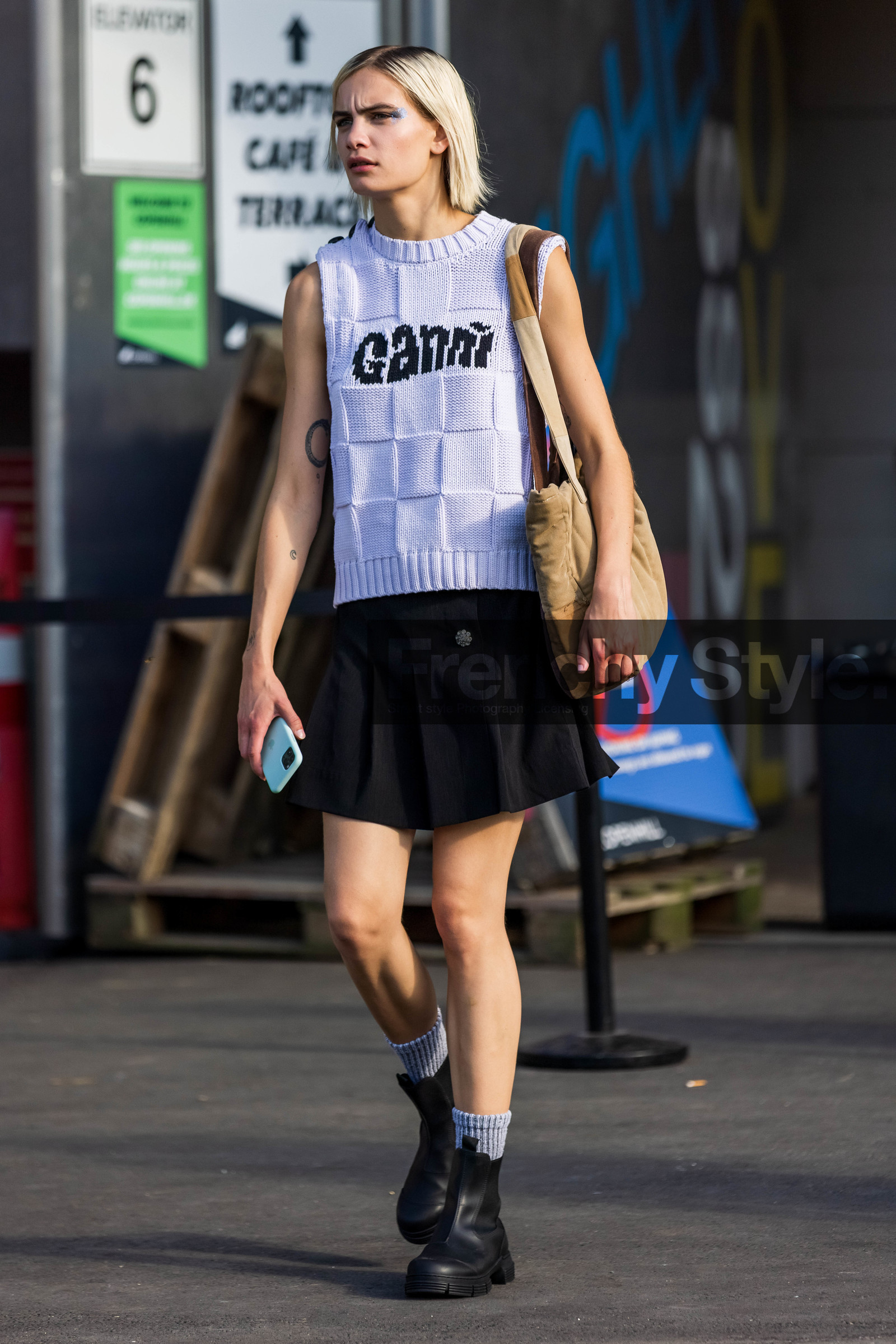 bag, beige bag, black boots, black skirt, boots, ganni knit, knit, knitted sock, knitwear, logo print, mini skirt, pleated skirt, printed knit, shirt skirt, silver eyeshadow, skirt, sleveless knit, sock, tote bag, white knit, Nina Marker, fashion week, frenchystyle, FW, jonathan paciullo, street style, CPHFW, COPENHAGEN, SS 22, SPRING SUMMER 2022, vertical, full length