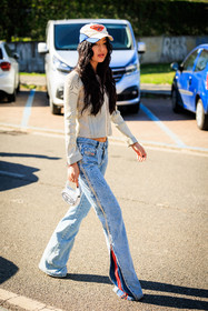 diesel logo cap, white cap, wavy hair, silver cardigan, pleated zipped cardigan, classic jeans, diesel jeans, mini diesel bag, zipped jeans, flared jeans, fashion week, frenchystyle, FW, jonathan paciullo, street style, MFW, MILAN, FALL WINTER 2022_2023, AUTUMN WINTER 2022-2023, FW 22-23, vertical, full length