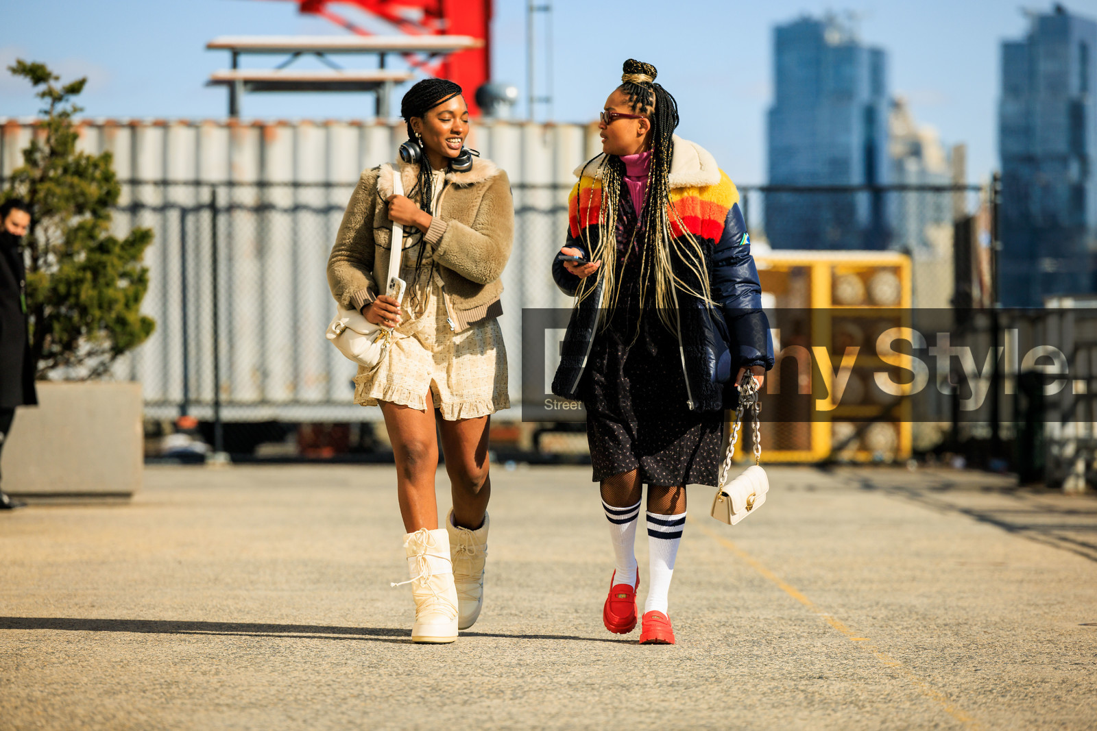 moon boots, white boots, winter boots, ski boots, buttoned mini dress, beige mini dress, furry short jacket, kaki short jacket, puffy coach bag, white coach bag, coach crossbody, headphones, multicolored winter jacket, coach winter jacket, puffy jacket, long braids, sunglasses, old school socks, red derbies, coach derbies, printed black dress, fashion week, frenchystyle, FW, jonathan paciullo, street style, NYFW, NEW YORK, AUTUMN WINTER 2022-2023, FALL WINTER 2022_2023, FW 22-23, atmosphere details, horizontal, full length