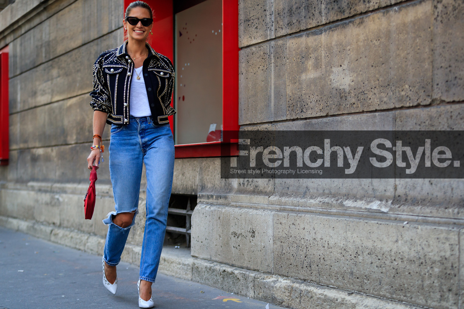 black jacket, blue denim, denim pants, embroidered jacket, graphic jacket, high heels, jeans, leather bag, leather shoes, necklace, red bag, ripped pants, studs, sunglasses, trousers, white shoes, white t shirt, PFW, fashion week, frenchystyle, FW, jonathan paciullo, street style, PARIS, horizontal, atmosphere details, full length, AUTUMN WINTER 2018-2019, FALL WINTER 2018-2019, FW 18-19, helena bordon