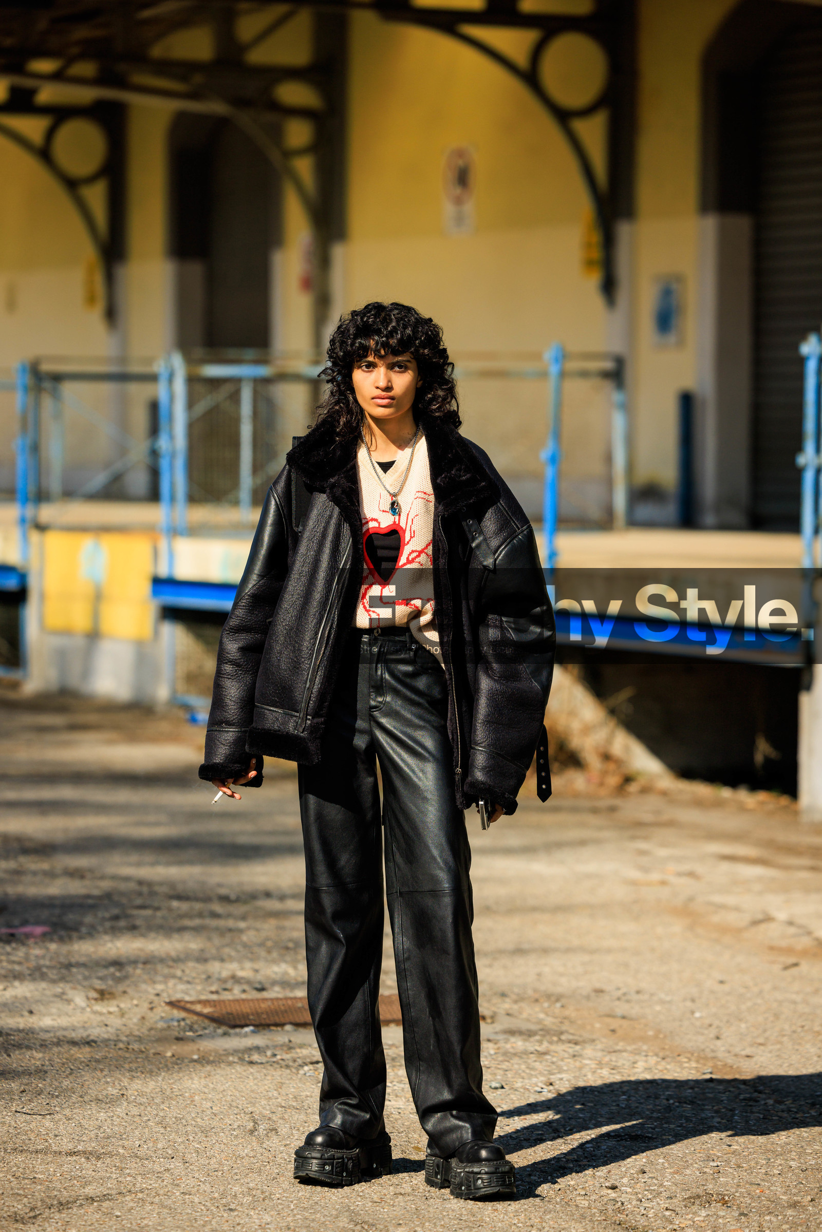 black jacket, leather jacket, heart cut out jumper, pink jumper, black pants, leather pants, black boots, pendant necklace, curly hair, model, fashion week, frenchystyle, FW, jonathan paciullo, street style, vertical, full length