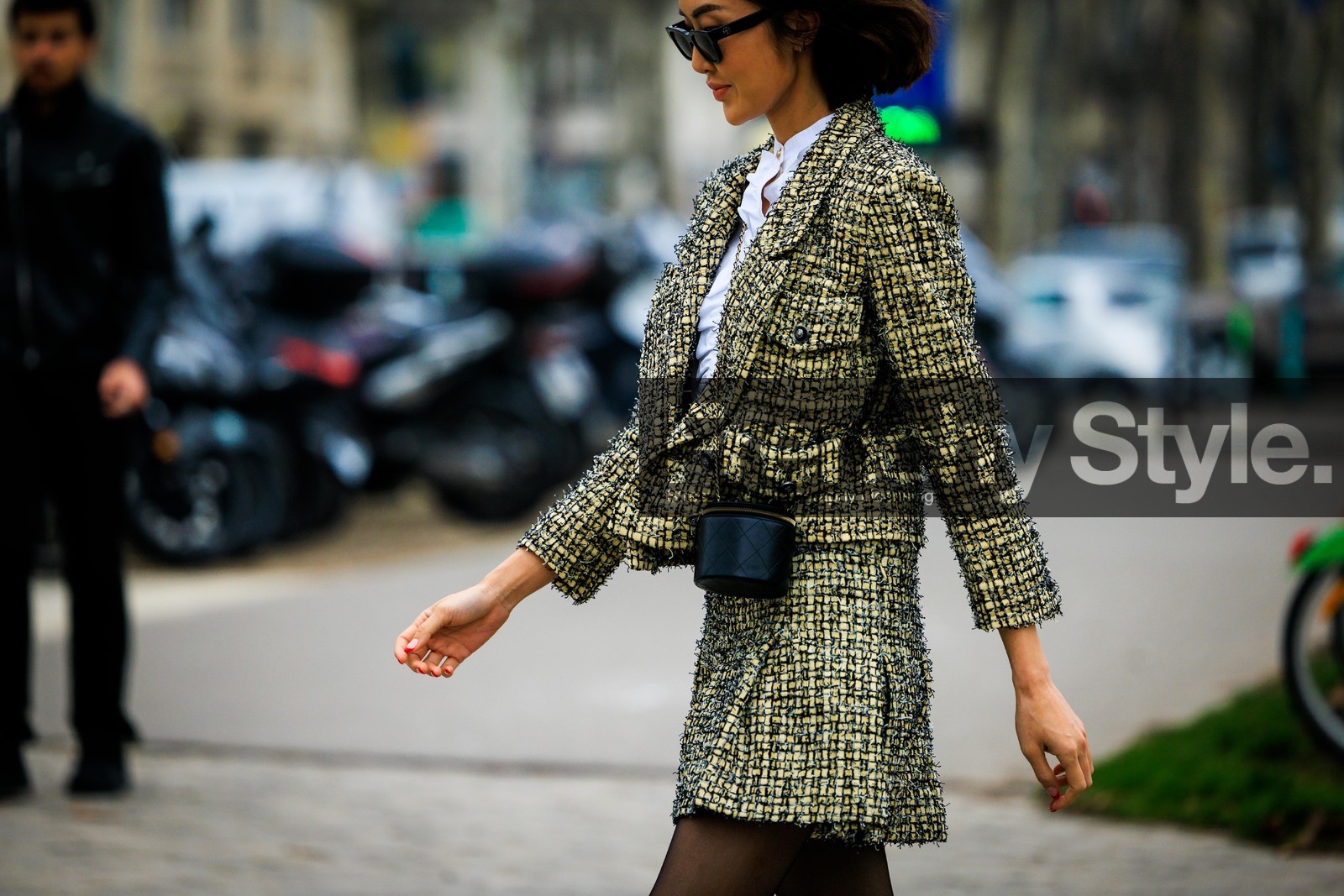 tweed set, chanel, tweed jacket, tweed skirt, mini skirt, yellow jacket, yellow skirt, pleated skirt, cylinder bag, mini bag, chanel bag, crossbody bag, black tights, white top, cropped top, black sunglasses, hair bow, fashion week, frenchystyle, FW, jonathan paciullo, street style, PARIS, PFW, SPRING SUMMER 2022, SS 22, atmosphere details, detail, horizontal, Chriselle Lim