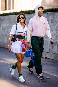 bag, black bag, black sunglasses, blue bag, color, couple, duo, green pants, green socks, jumper, lacoste look, Marc Forne, menswear, mini skirt, Nina Urgell Cloquell, orange jumper, pink jumper, pink polo, pleated skirt, polo, prada bag, skirt, sneakers, socks, stripes, sunglasses, tennis look, whie hoddie, white polo, white skirt, white sneakers, white sunglasses, lacoste, fashion week, frenchystyle, FW, jonathan paciullo, street style, PFW, PARIS, SPRING SUMMER 2022, SS 22, vertical, full length