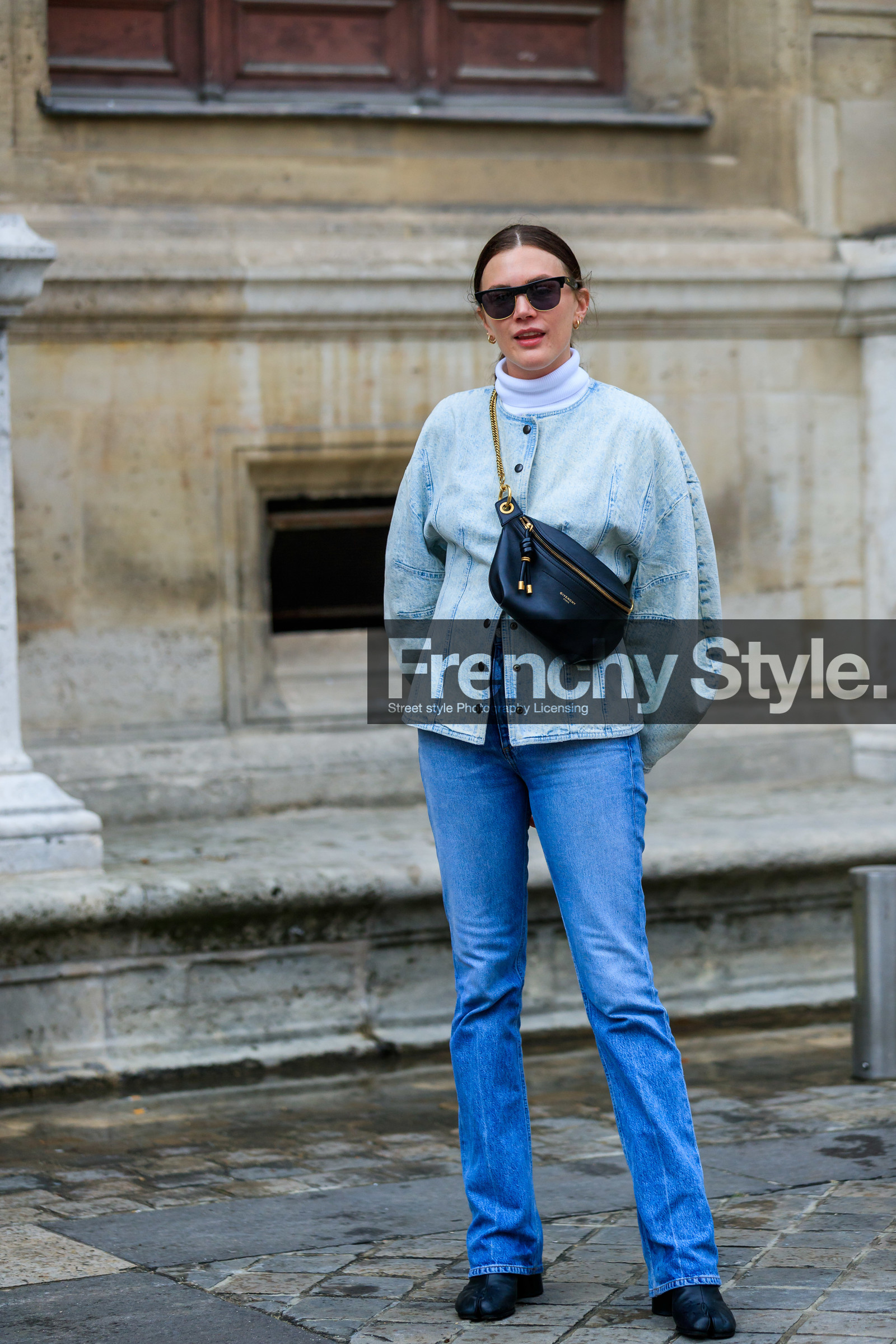 madelynn furlong, denim, denim jacket, denim total look, light blue jacket, light blue jeans, white pullover, turtleneck pullover, balloon sleeves, givenchy bag, black leather bag, crossbody bag, belt bag, golden chain strap bag, metalic frame sunglasses, black sunglasses, flare jeans, black leather boots, margiela boots, camel toe margiela boots, PARIS, PFW, SPRING SUMMER 2020, SS 20, fashion week, frenchystyle, FW, jonathan paciullo, street style, vertical, full length