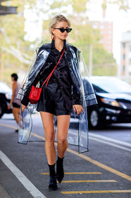 black boots, black shirt, black shoes, black shorts, caro daur, fashion week, frenchystyle, full length, FW, high heels, jonathan paciullo, leather bag, leather shoes, NEW YORK, NYFW, raincoat, red bag, SPRING SUMMER 2018, SS 18, street style, sunglasses, transparent coat, vertical