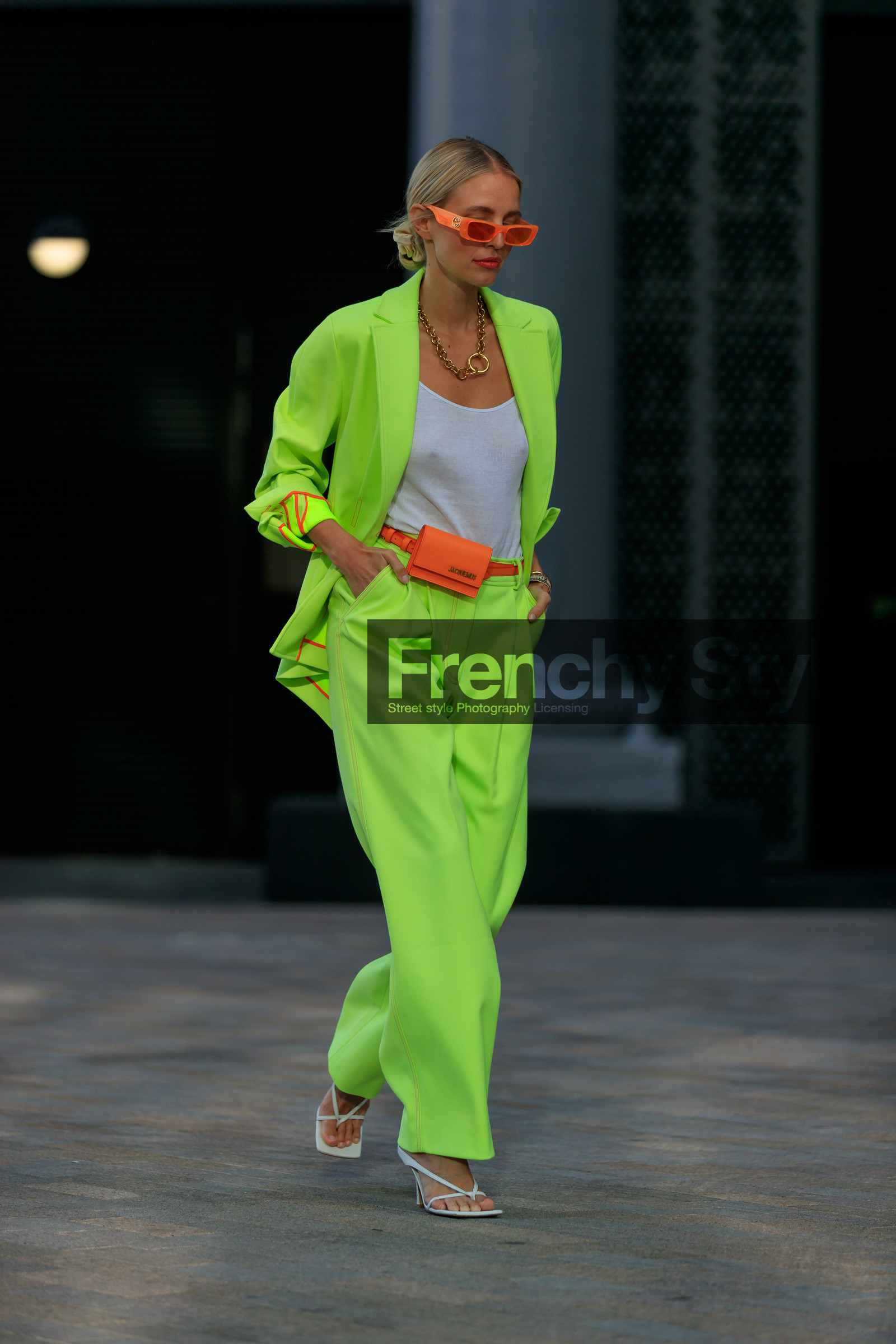 leonie hanne, suits, neon suits, gucci sunglasses, orange sunglasses, white top, big chain necklace, chain necklace, golden necklace, jacquemus bag, mini bag, orange leather bag, belt bag, bottega veneta shoes, white leather sandals, oversize jacket, oversize pants, oversize suits, neon yellow jacket, neon yellow pants, hair details, squared toed shoes, square shape bag, fashion week, frenchystyle, FW, jonathan paciullo, street style, vertical, full length