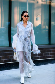 light blue dress, sheer dress, long dress, long sleeves dress, wrap dress, ruffle dress, white leather boots, white bag, pearls bag, hand bag, low boots, black sunglasses, butterfly sunglasses, silvered earrings, dangling earrings, pearl earrings, big earrings, fashion week, frenchystyle, FW, jonathan paciullo, street style, AUTUMN WINTER 2020-2021, FALL WINTER 2020-2021, FW 20-21, vertical, full length, NYFW, NEW YORK