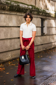 bag, black bag, flare pants, gold watch, leather bag, menswear, Nic Kaufmann, pants, pearl necklace, polo, red pants, rings, velvet pants, watch, white polo, lacoste, fashion week, frenchystyle, FW, jonathan paciullo, street style, PFW, PARIS, SPRING SUMMER 2022, SS 22, vertical, full length