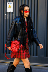 plaid look, punk look, red mini dress, plaid mini dress, balenciaga bag, red handbag, long braids, animal print fluo look, green fluo pants, baggy pants, fluo green top, leopard top, leopard pants, black bottines, leather bottines, black handbag, black sunglasses, black jacket, leather jacket, rockstar look, black blazer, leather blazer, fluo green necklace, chain necklace, classic jeans, black combat boots, black buttoned vest, fashion week, frenchystyle, FW, jonathan paciullo, street style, MFW, MILAN, FALL WINTER 2022_2023, AUTUMN WINTER 2022-2023, FW 22-23, vertical, atmosphere details