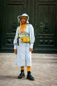 denim look, washed denim dress, bucket hat, denim hat, nylon fanny pack, prada fanny pack, prada bag, yellow hair, braids, afro hair, freckles, dr marten boots, combat boots, black boots, street style, jonathan paciullo, FW, frenchystyle, fashion week, AUTUMN WINTER 2022-2023, FALL WINTER 2022_2023, FW 22-23, PARIS, PFW, full length, vertical