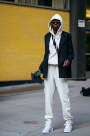 model, white hoodie, white pants, jogging pants, sportswear, black jacket, crossbody bag, metalic frame sunglasses, geometric shape glasses, nike shoes, white leather sneakers, fashion week, frenchystyle, FW, jonathan paciullo, street style, NYFW, NEW YORK, AUTUMN WINTER 2020-2021, FALL WINTER 2020-2021, FW 20-21, vertical, full length