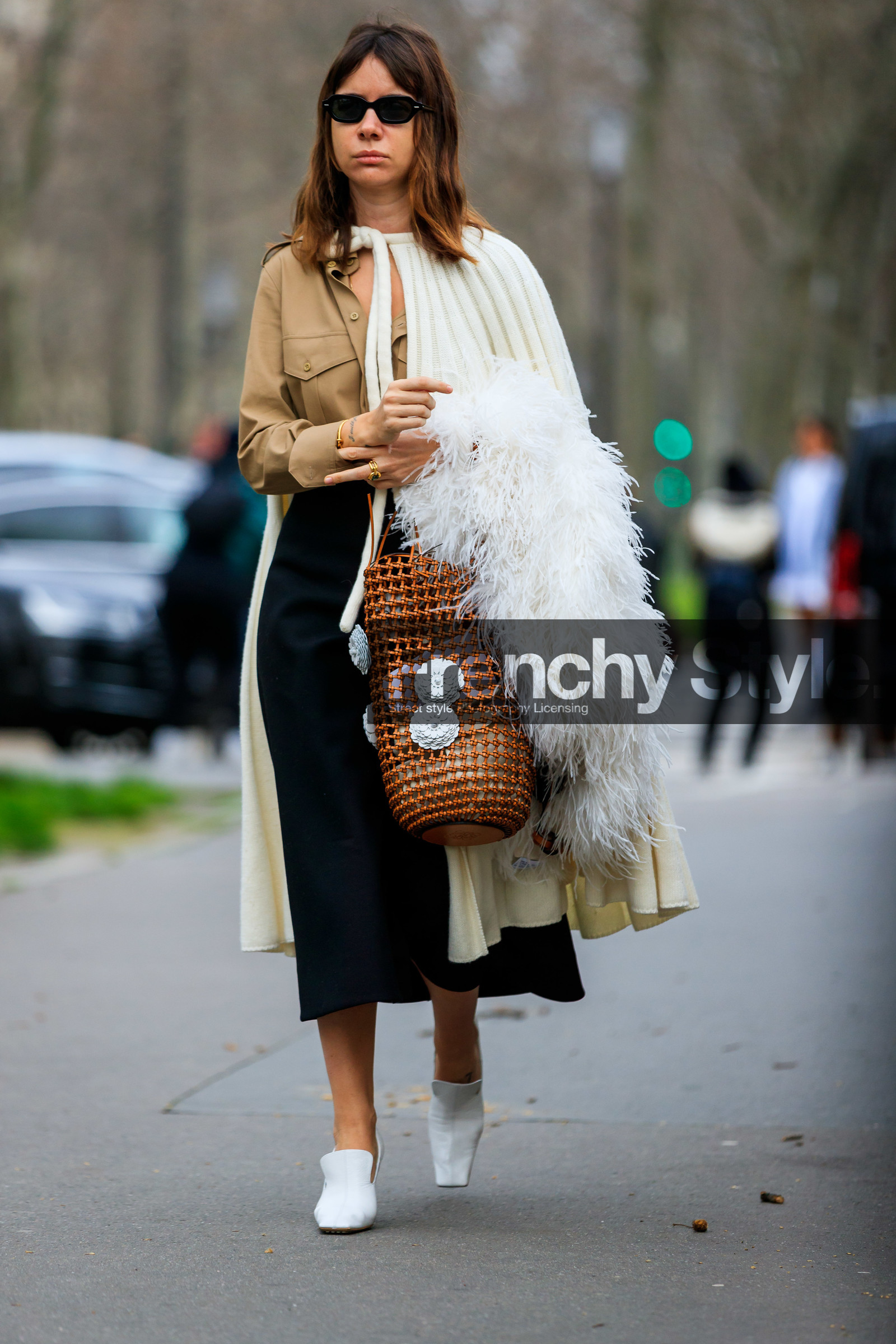 natasha goldenberg, white cape, knit cape, knitwear, beige shirt, camel leather bag, plaited bag, floral embroidered bag, basket bag, feather details, feather scarf, black skirt, black sunglasses, small sunglasses, white leather loafers, mid long skirt, loewe bag, loewe cape, fashion week, frenchystyle, FW, jonathan paciullo, street style, PFW, PARIS, AUTUMN WINTER 2020-2021, FALL WINTER 2020-2021, FW 20-21, vertical, full length