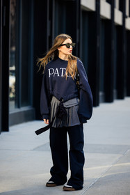 patou black sweatshirt, black cat eye sunglasses, silver pleated skirt, school girl skirt, oversiwed black pants, black and white sneakers, Allegra shaw, fashion week, frenchystyle, FW, jonathan paciullo, street style, NYFW, NEW YORK, AUTUMN WINTER 2022-2023, FALL WINTER 2022_2023, FW 22-23, vertical, full length