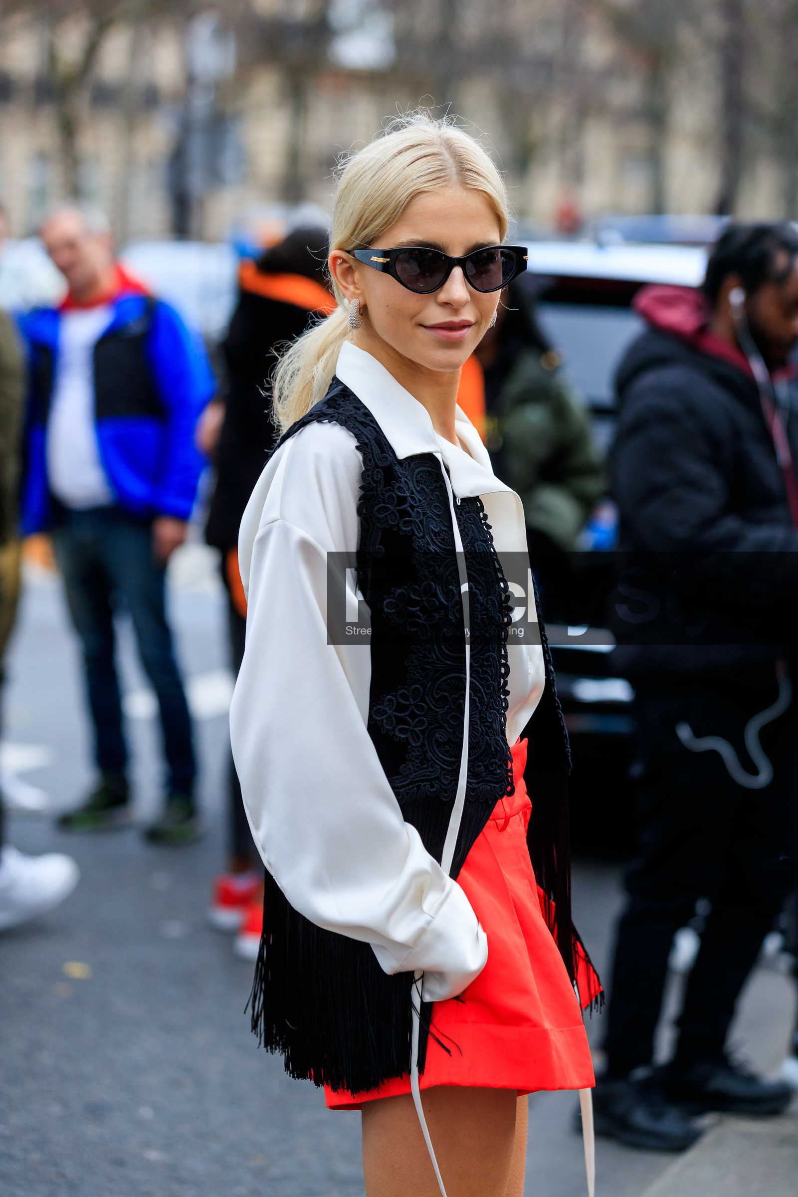 caro daur, white shirt, black jacket, lace jacket, sleeveless jacket, black sunglasses, butterfly sunglasses, red shorts, bottega veneta sunglasses, fringe jacket, diamond earrings, round shape earrings, celine earrings, elie saab jacket, elie saab look, fashion week, frenchystyle, FW, jonathan paciullo, street style, PFW, PARIS, vertical, atmosphere details, detail