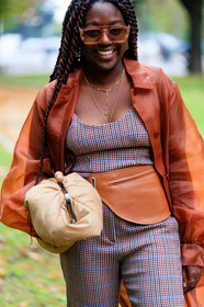 orange glasses, orange jacket, organza jacket, long jacket, checked pants, checked top, blue pants, blue top, red pants, red top, burgundy pants, burgundy top, camel leather bag, camel leather belt, belt bag, light beige leather clutch, golden necklace, multi necklace, lois opoku, street style, jonathan paciullo, FW, frenchystyle, fashion week, MFW, MILAN, SPRING SUMMER 2021, SS 21, vertical, detail
