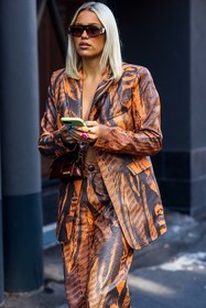 blazer, Caroline Ebo, jacquemus bag, leather bag, leather blazer, leather pants, orange blazer, orange pants, printed blazer, printed pants, red bag, smartphone, suit, sunglasses, fashion week, frenchystyle, FW, jonathan paciullo, street style, MFW, MILAN, SPRING SUMMER 2022, SS 22, vertical, atmosphere details, detail