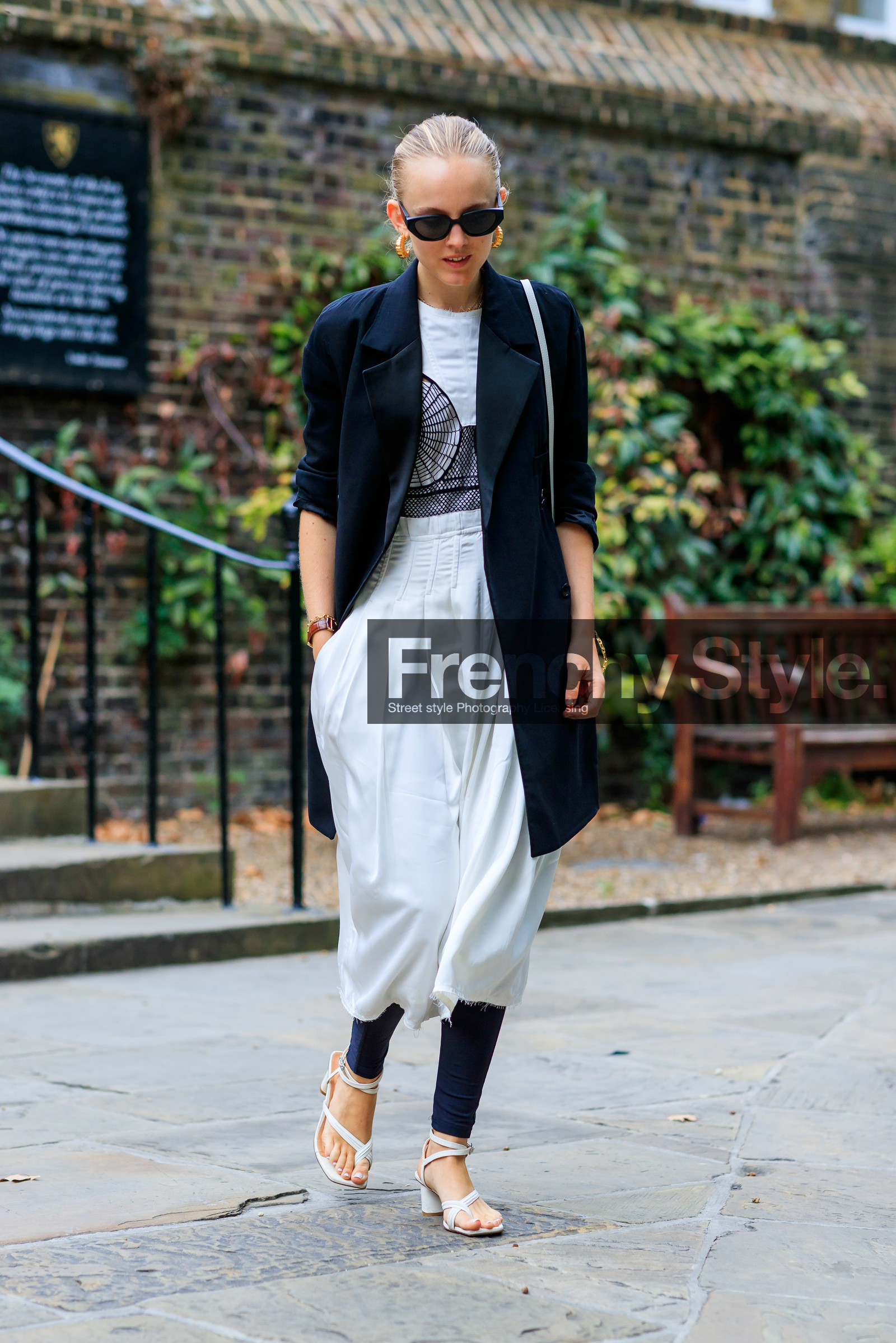 alexandra carl, black and white look, white skirt, silk skirt, mid long skirt, black legging, white t-shirt, embroidered t-shirt, used skirt, used t-shirt, black jacket, long jacket, multi straps sandals, white sandals, butterfly sunglasses, black sunglasses, hoop earrings, golden earrings, aviator glasses, fashion week, frenchystyle, FW, jonathan paciullo, street style, vertical, full length