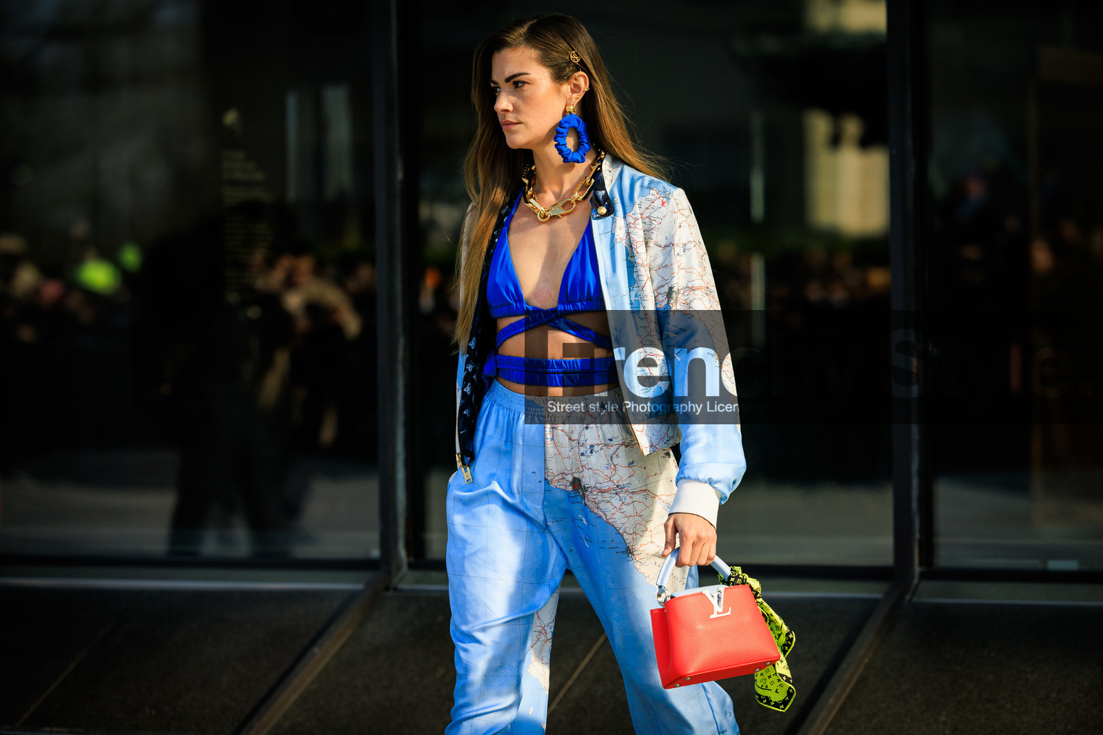 louis vuitton, printe jacket, pastel blue jacket, blue earrings, golden chain, golden necklaces, blue bra top, cut out top, printed trousers, red handbag, louis vuitton bag, logo bad, small bag, green scarf, printed scarf, pastel blue trousers, clara berry, street style, jonathan paciullo, FW, frenchystyle, fashion week, AUTUMN WINTER 2022-2023, FALL WINTER 2022_2023, FW 22-23, horizontal, PFW, PARIS, atmosphere details, detail