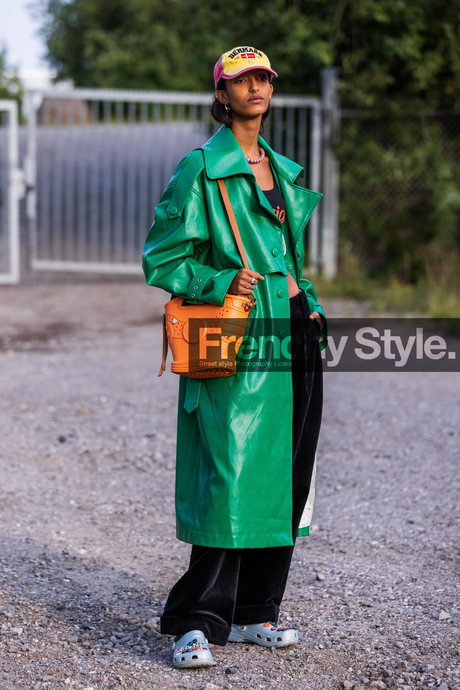bag, black crop top, black pants, cap, coat, color, corduroy pants, crocs, green coat, grey sabots, lanvin bag, large pants, leather coat, long coat, necklace, orange bag, printed cap, printed coat, red cap, yellow cap, Mona Tougaard, fashion week, frenchystyle, FW, jonathan paciullo, street style, CPHFW, COPENHAGEN, SS 22, SPRING SUMMER 2022, vertical, full length