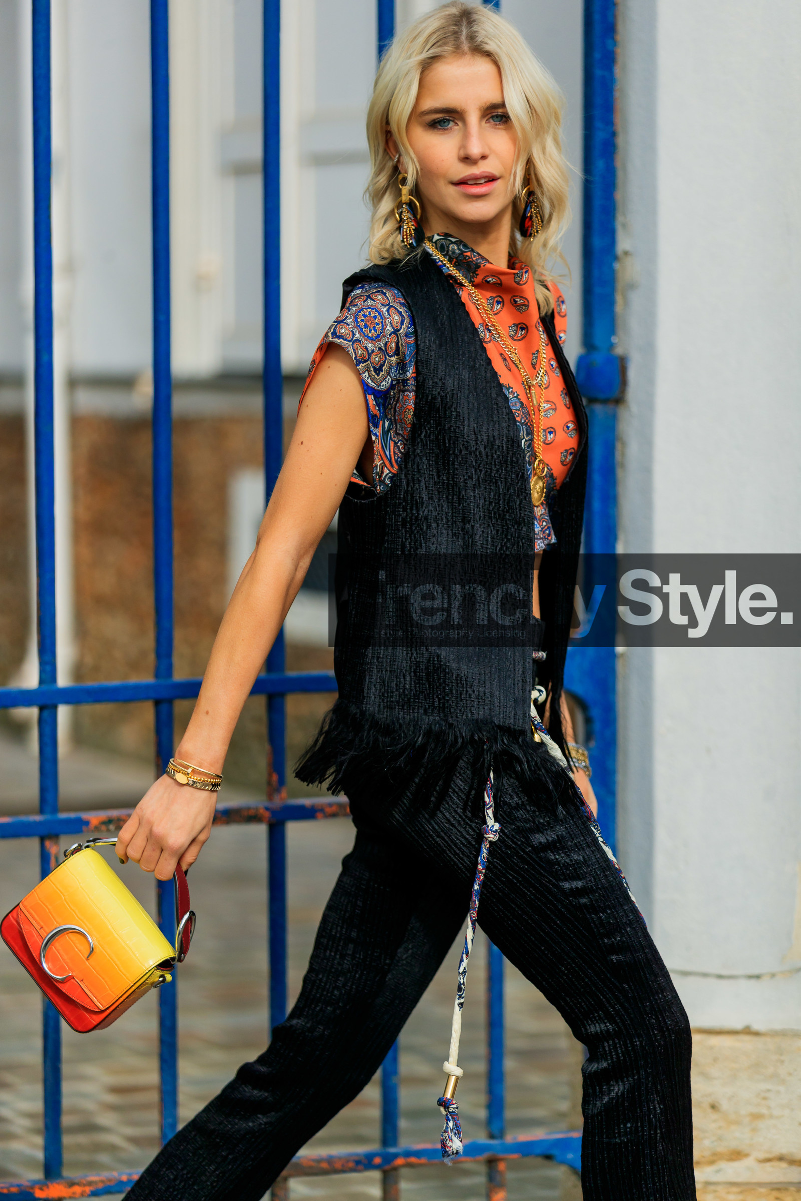 black jacket, black pants, bracelet, caro daur, chloé, earrings, graphic top, leather bag, orange bag, orange top, printed top, red bag, sleeveless, sunglasses, vest, white belt, yellow bag, PARIS, PFW, street style, jonathan paciullo, FW, frenchystyle, fashion week, AUTUMN WINTER 2019-2020, AW 19-20, FALL WINTER 2019-2020, FW 19-20, vertical, atmosphere details, detail