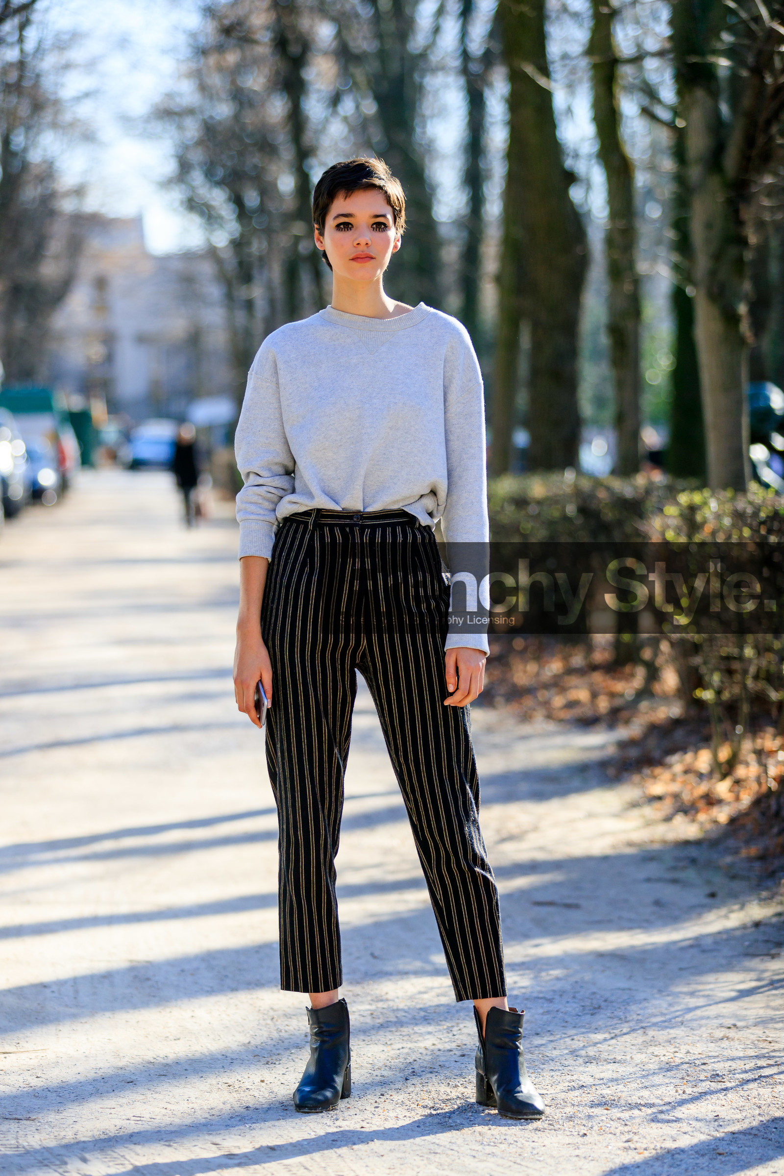 black pants, black shoes, eyeliner, graphic pants, grey sweater, leather shoes, printed pants, short hair, striped pants, trousers, model, PARIS, PFW, street style, jonathan paciullo, FW, frenchystyle, fashion week, AUTUMN WINTER 2019-2020, AW 19-20, FALL WINTER 2019-2020, FW 19-20, vertical, full length