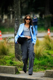 loewe top, grey top, blue shirt, casual look, black belt, furry pouch, black pouch, grey pants, cargo pants, baggy pants, black heels, black sunglasses, chloe loulou de saison, street style, jonathan paciullo, FW, frenchystyle, fashion week, AUTUMN WINTER 2022-2023, FALL WINTER 2022_2023, FW 22-23, PFW, PARIS, full length, vertical