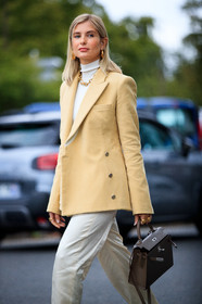 xenia adonts, light yellow jacket, beige jacket, white pullover, white pants, satin pants, turtleneck pullover, loose pants, hermes jacket, golden necklace, golden earrings, golden ring, multi earrings, big chain necklace, brown leather bag, hermes bag, kelly hermes bag, hoop earrings, mini hoop earrings, diamond earrings, white total look, beige total look, fashion week, frenchystyle, FW, jonathan paciullo, street style, PFW, PARIS, SPRING SUMMER 2021, SS 21, vertical, atmosphere details, detail
