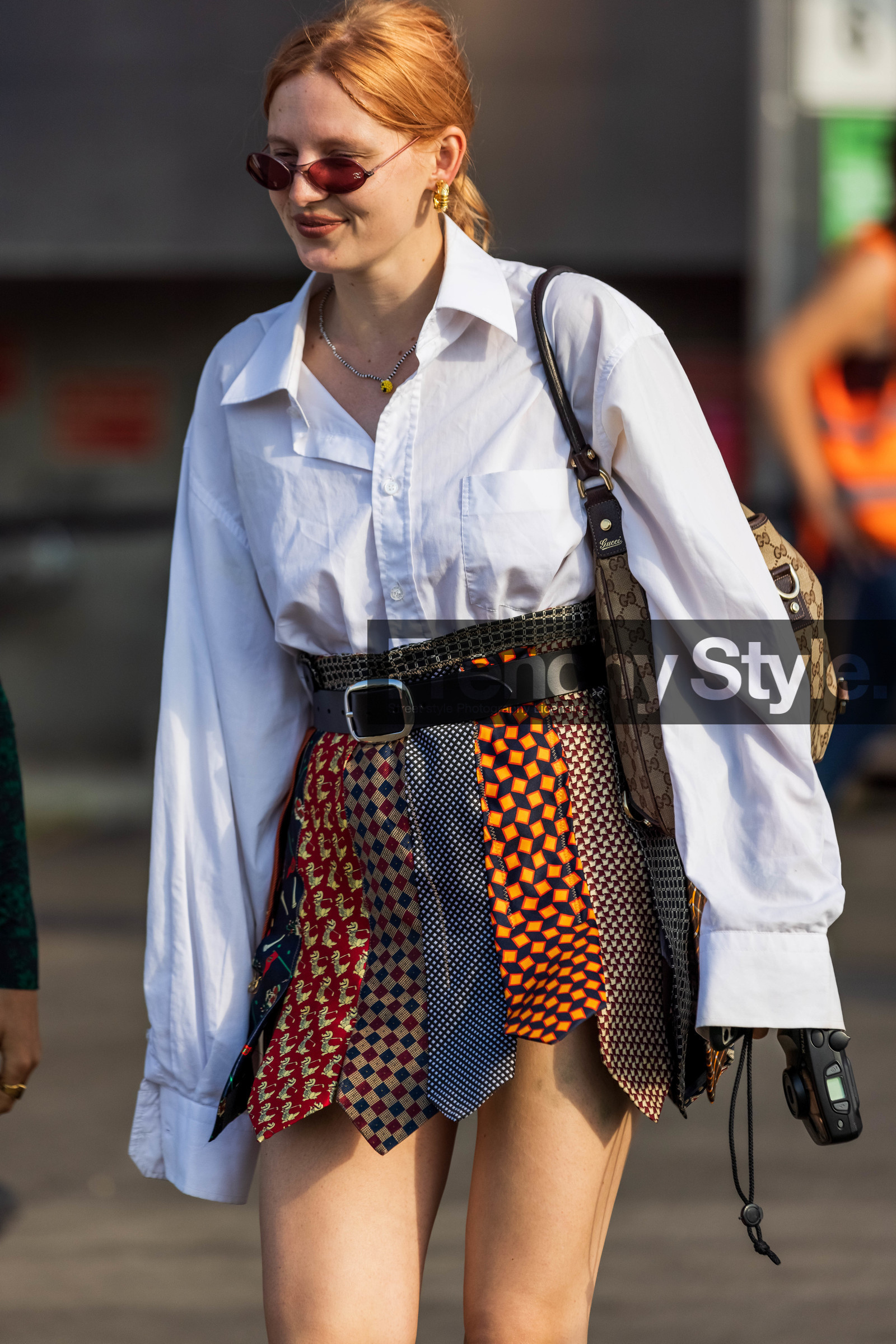 back belt, bag, belt, brown bag, brown skirt, checked skirt, color, gucci bag, leather belt, logo bag, mini skirt, multicolor, patchwork, print, printed bag, printed skirt, red sunglasses, shirt, short skirt, skirt, sunglasses, white shirt, Lotta Lavanti, fashion week, frenchystyle, FW, jonathan paciullo, street style, CPHFW, COPENHAGEN, SS 22, SPRING SUMMER 2022, vertical, atmosphere details