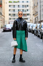 megan adelaide, black vinyl jacket, black polish shoes, black pullover, black socks, flat shoes, big sole shoes, prada shoes, turtleneck pullover, green skirt, mid long skirt, asymmetrical skirt, checked skirt, white leather bag, monogrammed bag, hand bag, courreges bag, courreges jacket, PARIS, PFW, SPRING SUMMER 2020, SS 20, fashion week, frenchystyle, FW, jonathan paciullo, street style, vertical, full length