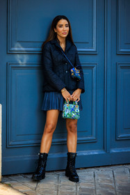mini lady dior, dior bag, printed bag, blue bag, black boots, combat boots, pleated skirt, mini skirt, dior jacket, navy blue jacket, blue skirt, crossbody baf, mini bag, crossbody bag, fashion week, frenchystyle, FW, jonathan paciullo, street style, PARIS, PFW, SPRING SUMMER 2022, SS 22, full length, vertical, tamara kalinic