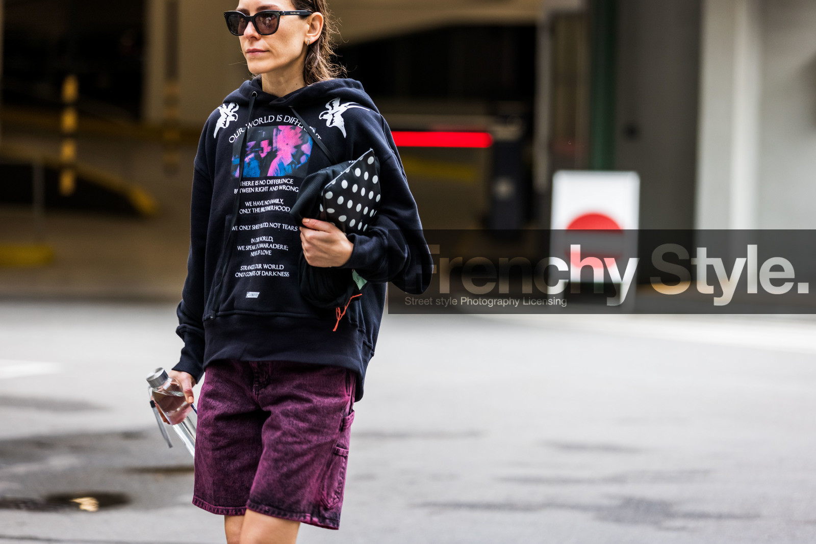 black hoodie, printed hoodie, letter printed hoodie, purple shorts, denim, denim shorts, polka dots clutch, black leather clutch, white leather clutch, bicolor clutch, celine sunglasses, fashion week, frenchystyle, FW, jonathan paciullo, street style, SPRING SUMMER 2022, SS 22, COPENHAGEN, CPHFW, atmosphere details, horizontal