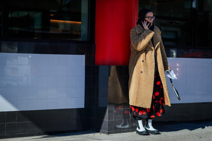 beige jacket, black bag, black skirt, black sweater, camel coat, céline, embroidered skirt, floral, flowers, Fur coat, graphic skirt, headband, hoodie, leather bag, leather shoes, printed skirt, shearling, sunglasses, white boots, street style, jonathan paciullo, FW, frenchystyle, fashion week, NYFW, NEW YORK, AUTUMN WINTER 2018-2019, AW 18-19, FALL WINTER 2018-2019, FW 18-19, atmosphere details, horizontal, full length, Lucy Chadwick