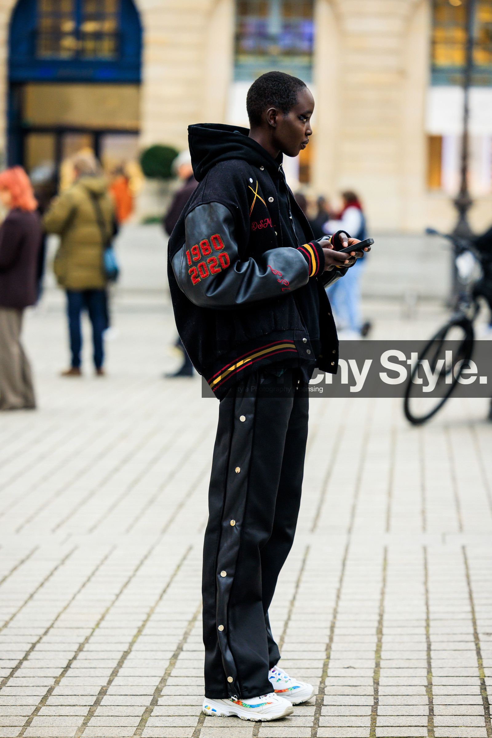 shrot hair, black jacket, baseball jacket, vintage jacket, printed jacket. 90 look, side buttoned trousers, black trousers, satin trouers, white sneakers, fashion week, frenchystyle, FW, jonathan paciullo, street style, PARIS, PFW, SPRING SUMMER 2022, SS 22, full length, vertical, model